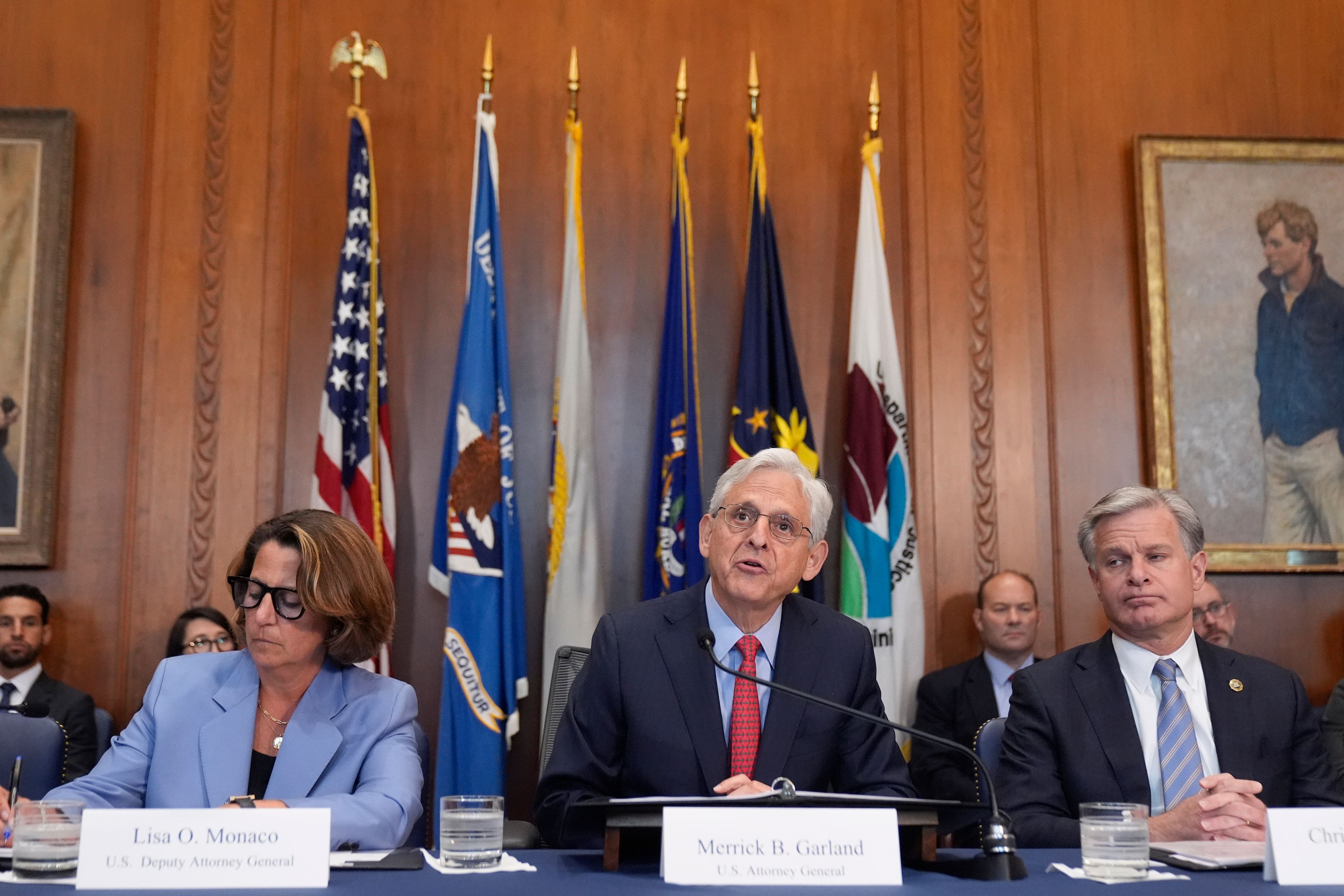 Attorney General Merrick Garland speaks during a meeting of the Justice Department's Election Threats Task Force, at the Department of Justice, Wednesday, Sept. 4, 2024, in Washington, with Deputy Attorney General Lisa Monaco, left, and FBI Director Christopher Wray, right. (AP Photo/Mark Schiefelbein)