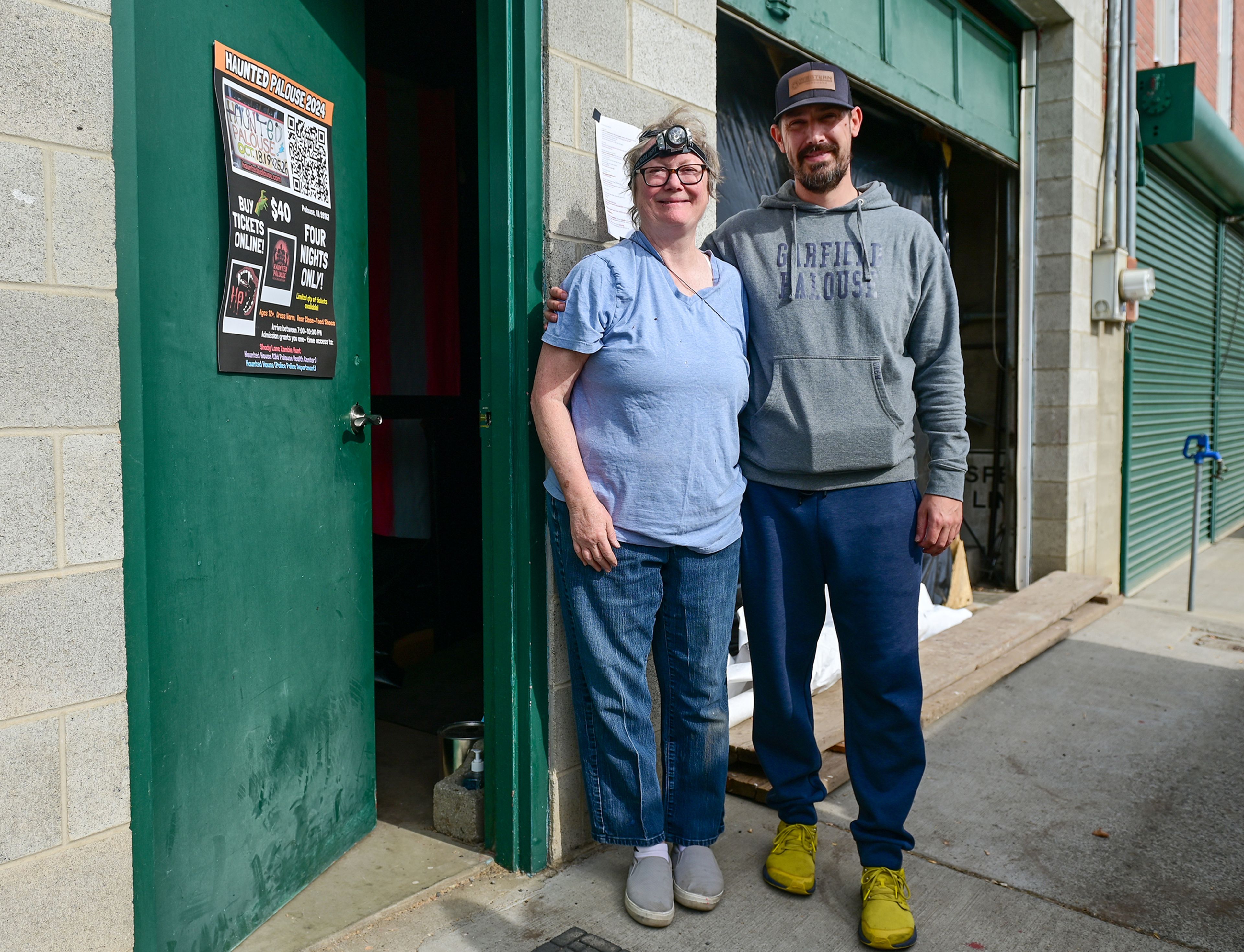 Karen Peltier, left, haunted house designer, and Will Perry, director of Haunted Palouse, stand outside the entrance of the haunted house being held on the ground level of the Palouse Police Station Tuesday for this years Haunted Palouse event.