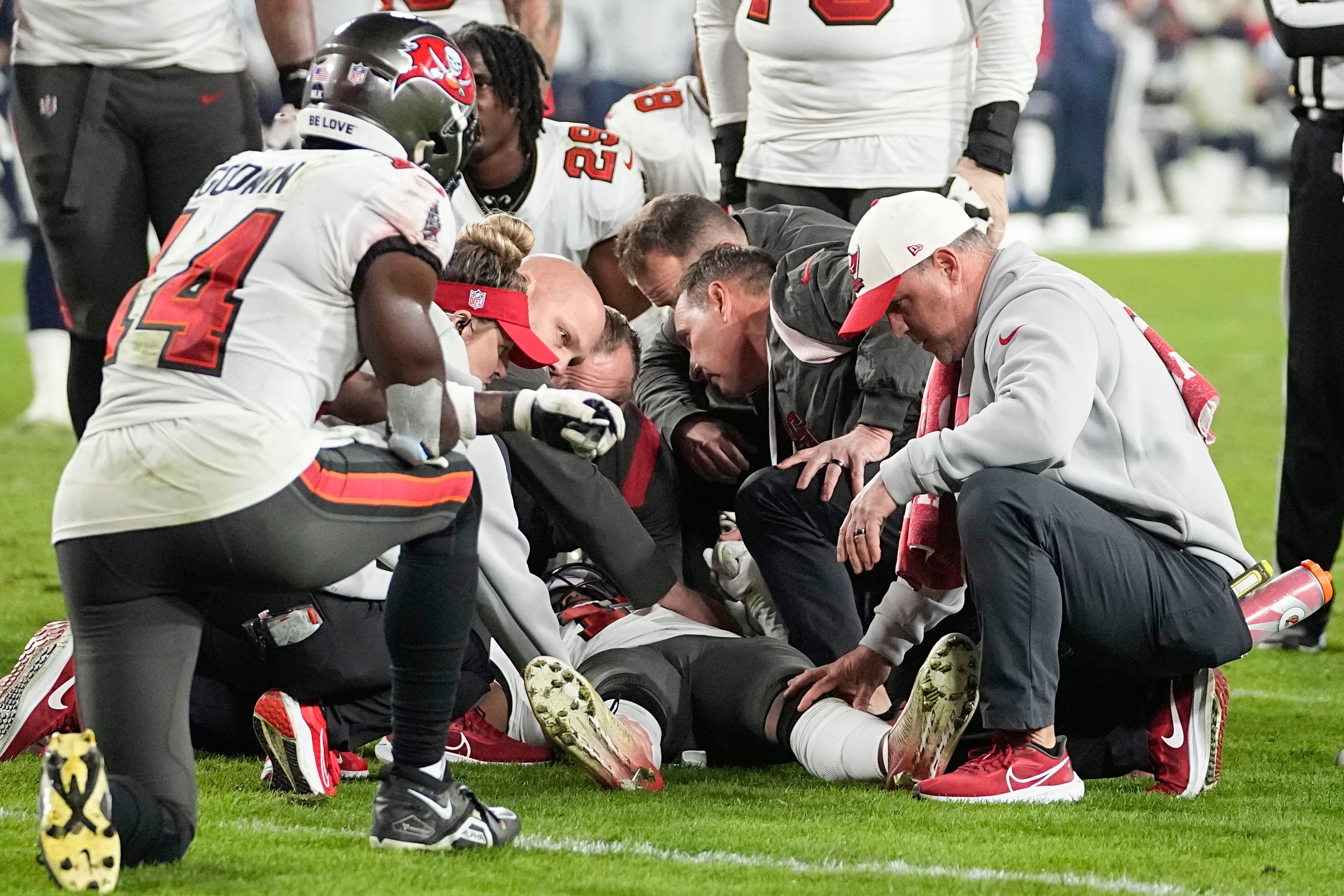 Tampa Bay Buccaneers wide receiver Russell Gage is helped after an injury against Dallas Cowboys safety Donovan Wilson during the second half of an NFL wild-card football game, Monday, Jan. 16, 2023, in Tampa, Fla. (AP Photo/Chris Carlson)