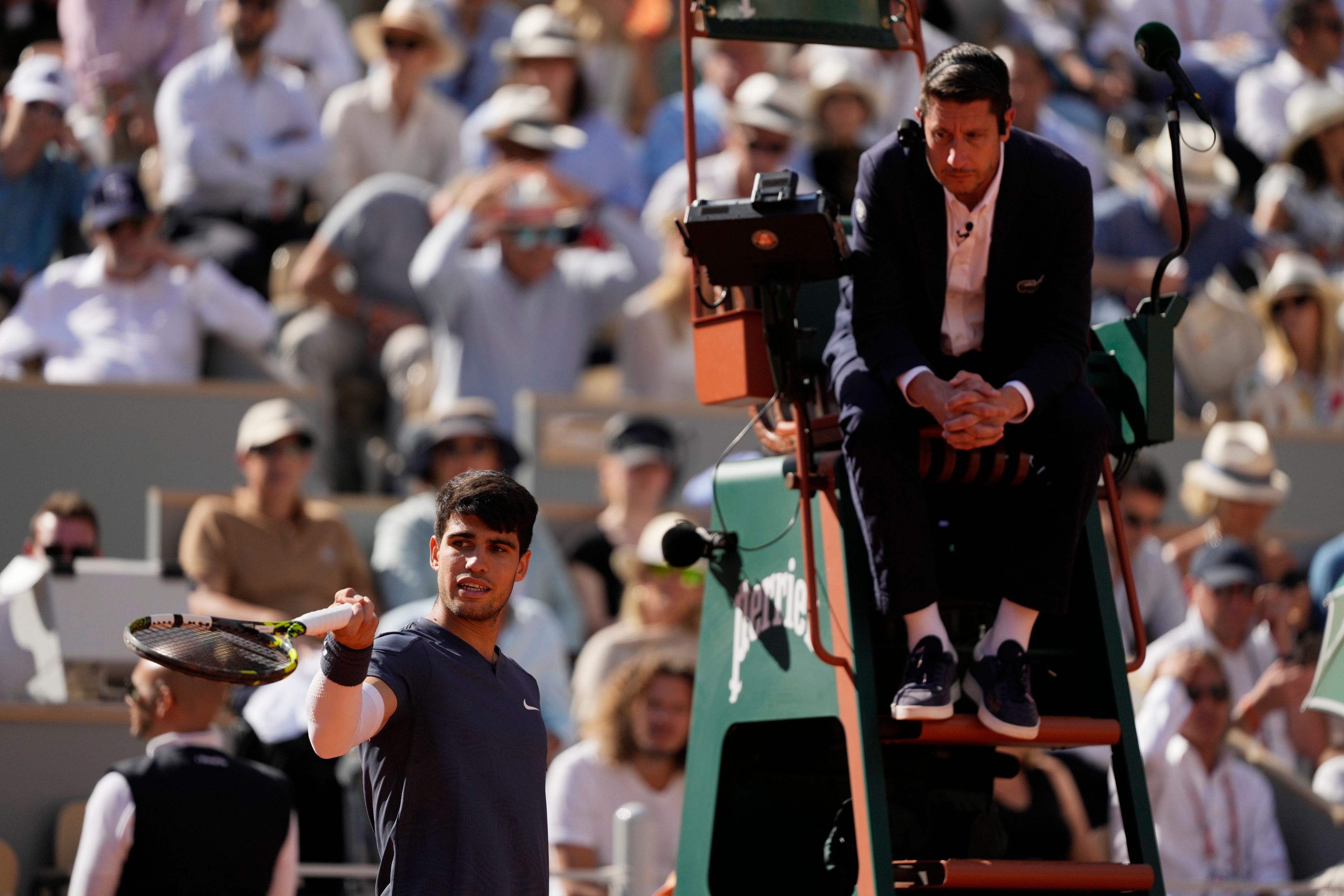 Spain's Carlos Alcaraz reacts as he plays against Germany's Alexander Zverev during the men's final match of the French Open tennis tournament at the Roland Garros stadium in Paris, Sunday, June 9, 2024.