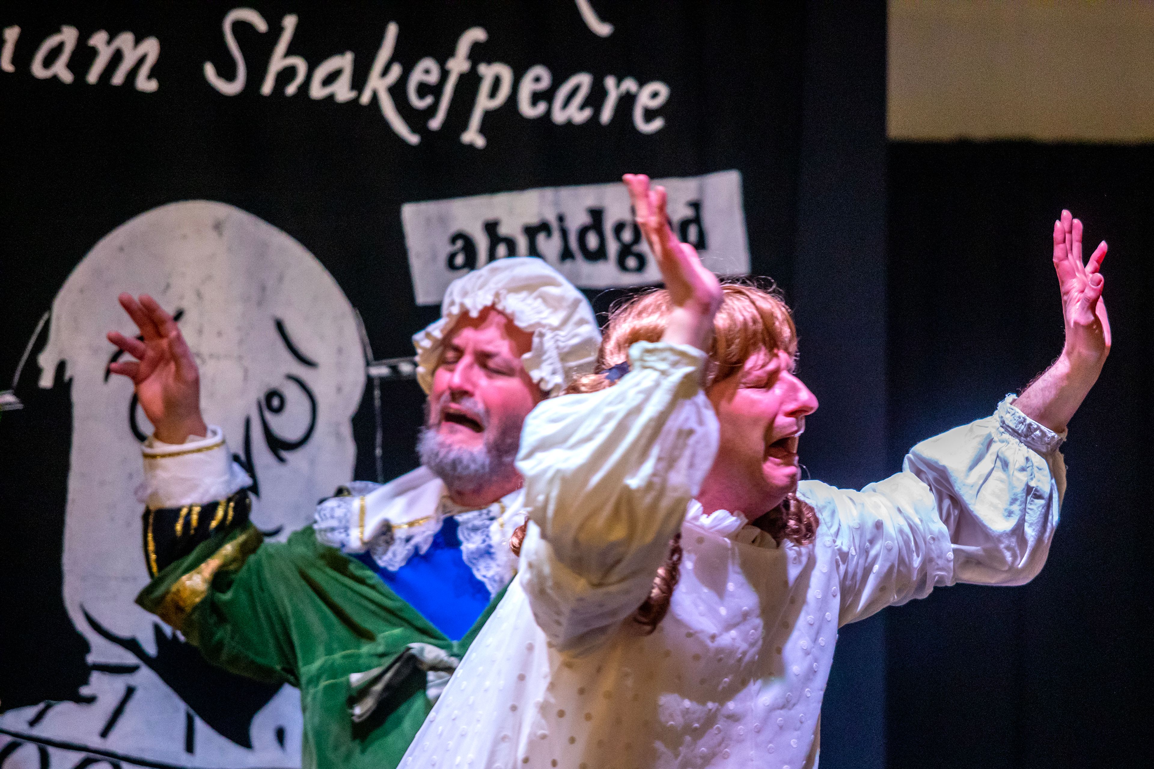 Jacob Trickey, left, and Travis Osburn, playing Juliet break into hysterics at the news of Romeo’s death during a rehearsal for “The Complete Works of William Shakespeare (Abridged)” Thursday last week at Lindsay Creek Vineyards in Lewiston.