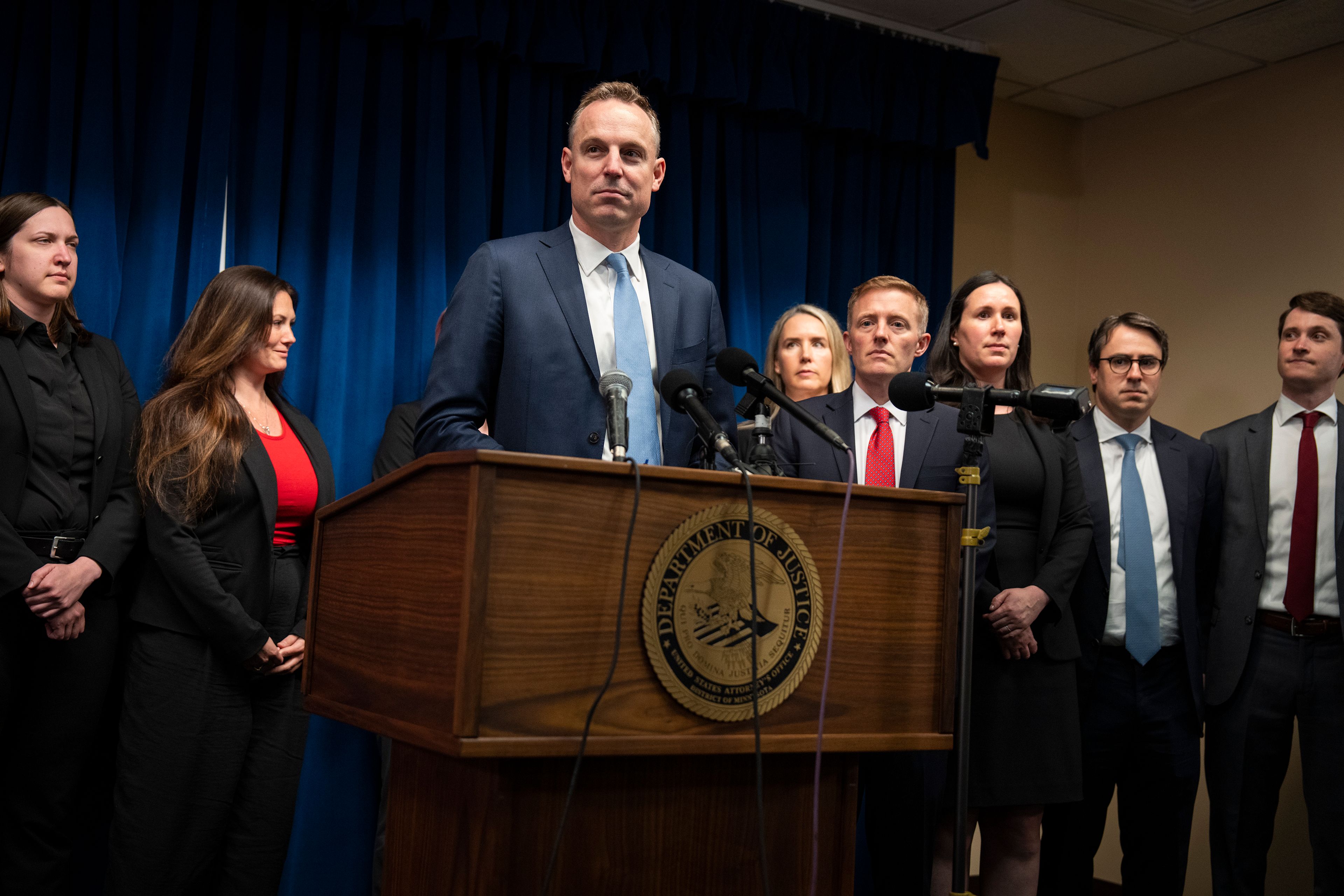 Assistant U.S. Attorney Joe Thompson, surrounded by the prosecution's trial team, speaks during a news conference after the verdict was read in the first Feeding Our Future case at the federal courthouse in Minneapolis, Friday, June 7, 2024. A jury convicted five Minnesota residents and acquitted two others Friday for their roles in a scheme to steal more than $40 million that was supposed to feed children during the coronavirus pandemic.