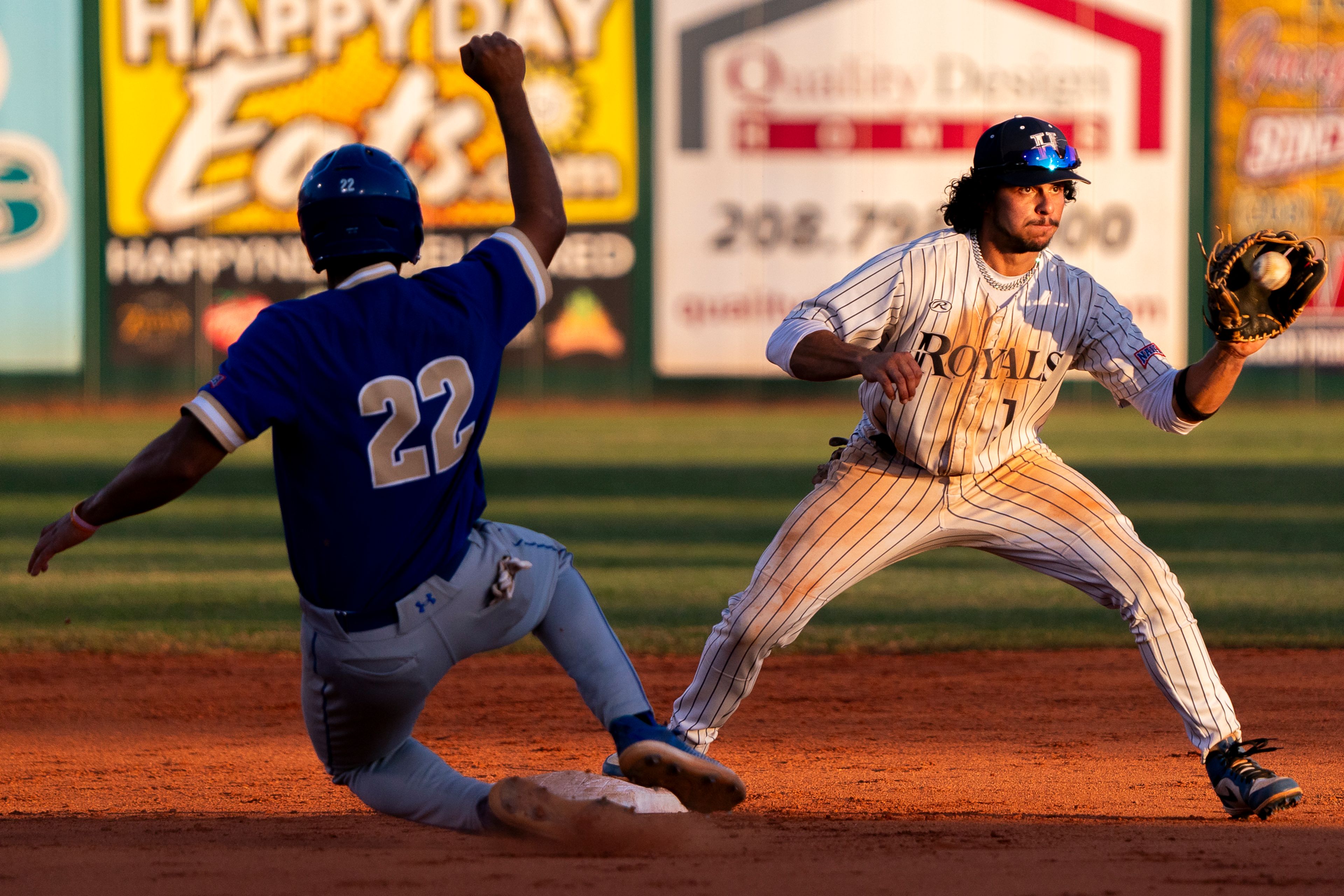 Hope International shortstop David Rivera, right, catches a throw to second base during Game 19 of the NAIA World Series against Tennessee Wesleyan on Friday at Harris Field in Lewiston.