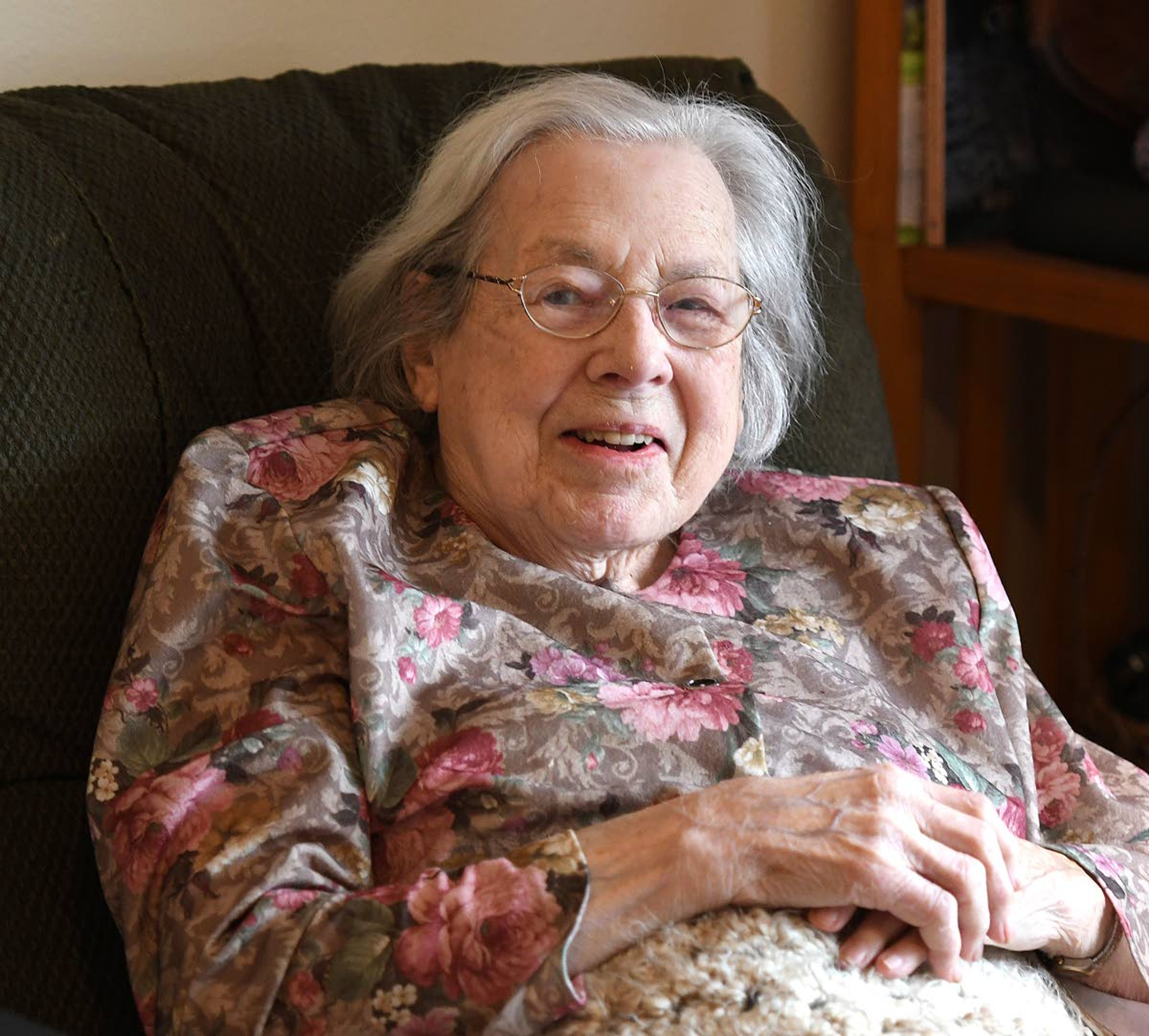 Pullman’s Julia Cohen cracks a smile in her room at Bishop Place. Cohen, a founder of what became the Washington-Idaho Symphony, recently turned 100 years old.