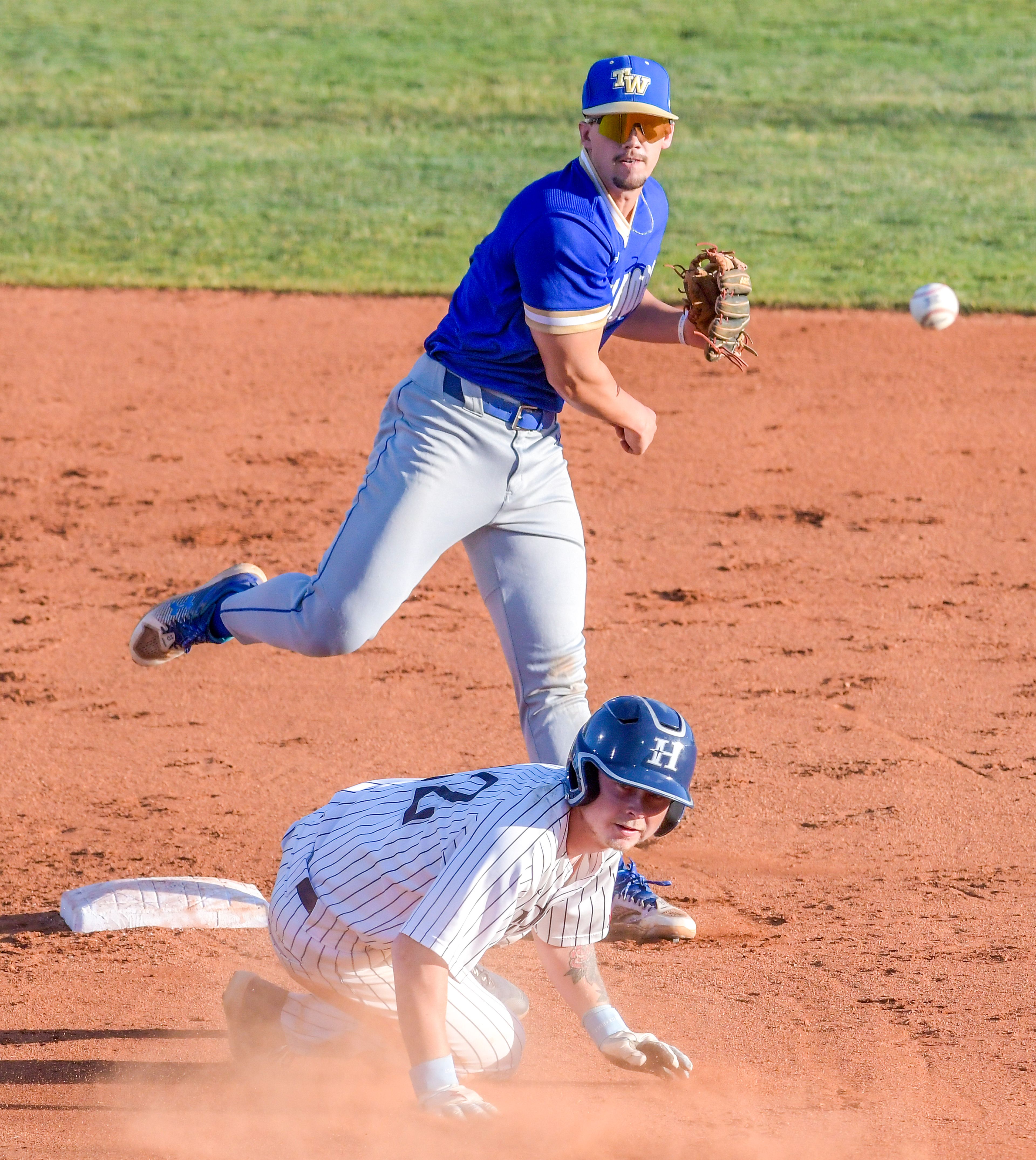 Tennessee Wesleyan second baseman Cayle Webster throws to first after tagging out Ryan Lamastra in Game 19 of the NAIA World Series on Friday at Harris Field in Lewiston.