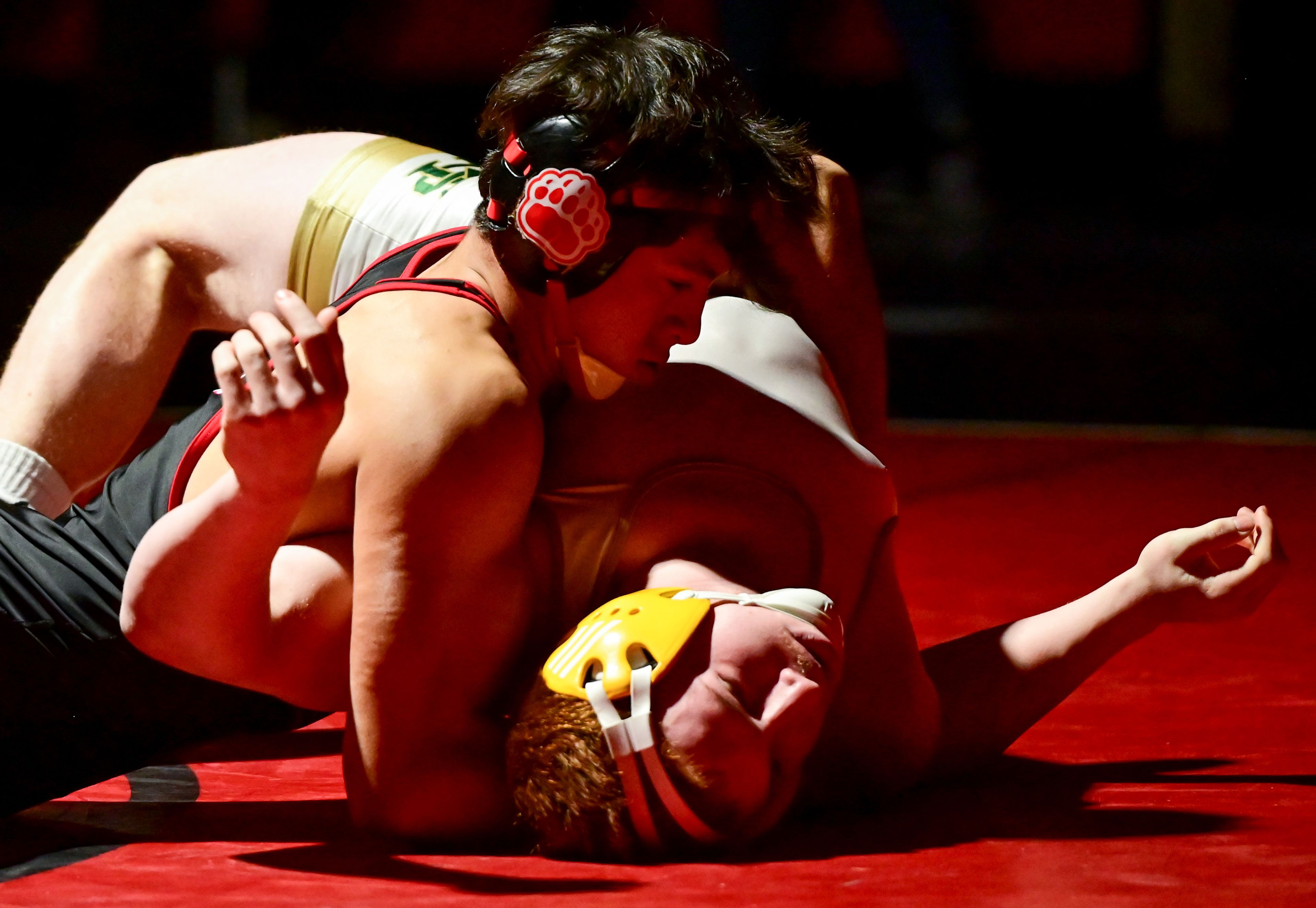 Moscow’s James Greene pins St. Maries’ Zach Sotin during a match Thursday at Bear Den in Moscow..