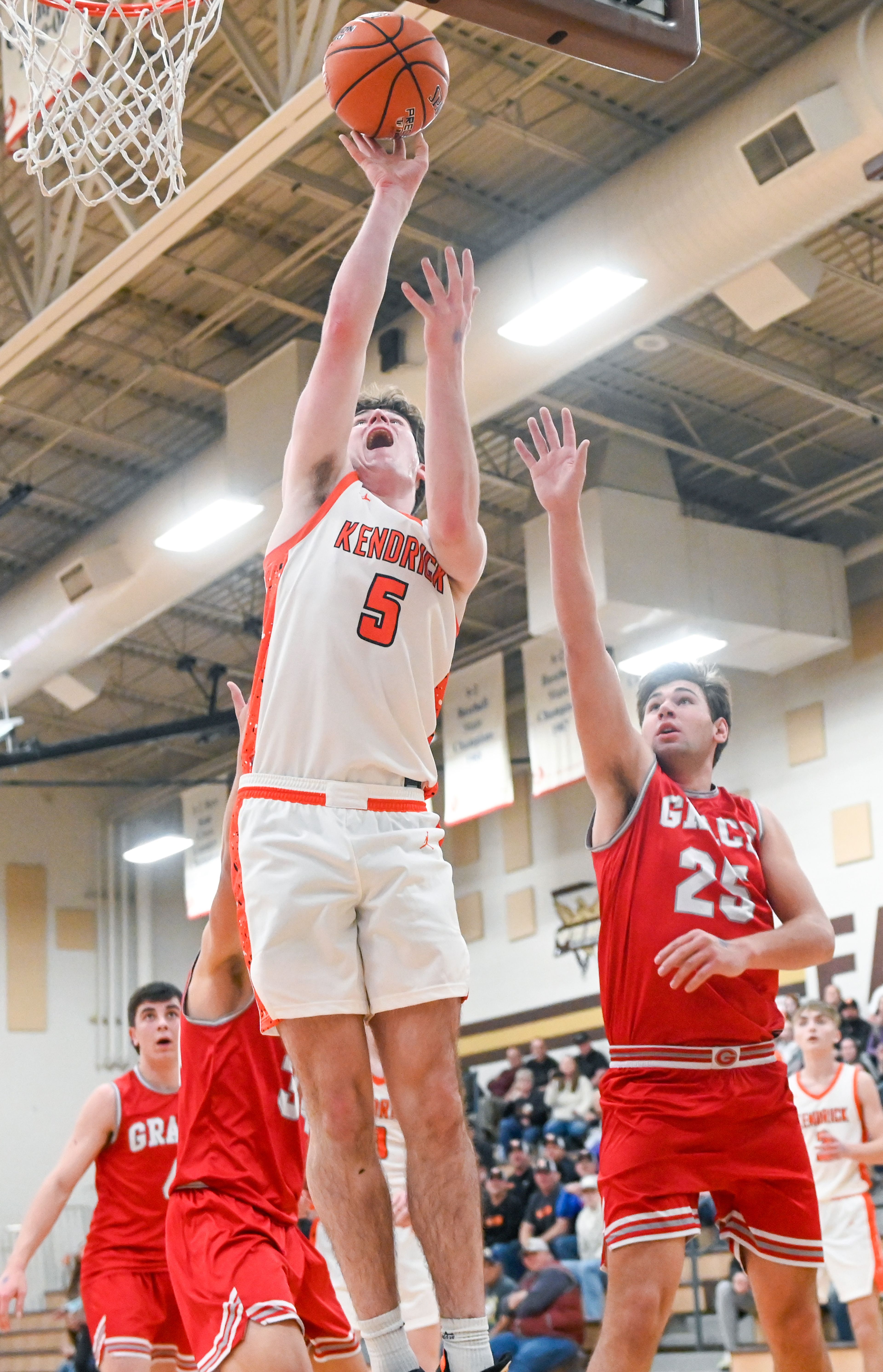 Kendrick's Wyatt Cook jumps for a two-point shot against Grace at the Idaho 2A state tournament on Friday in Caldwell, Idaho.