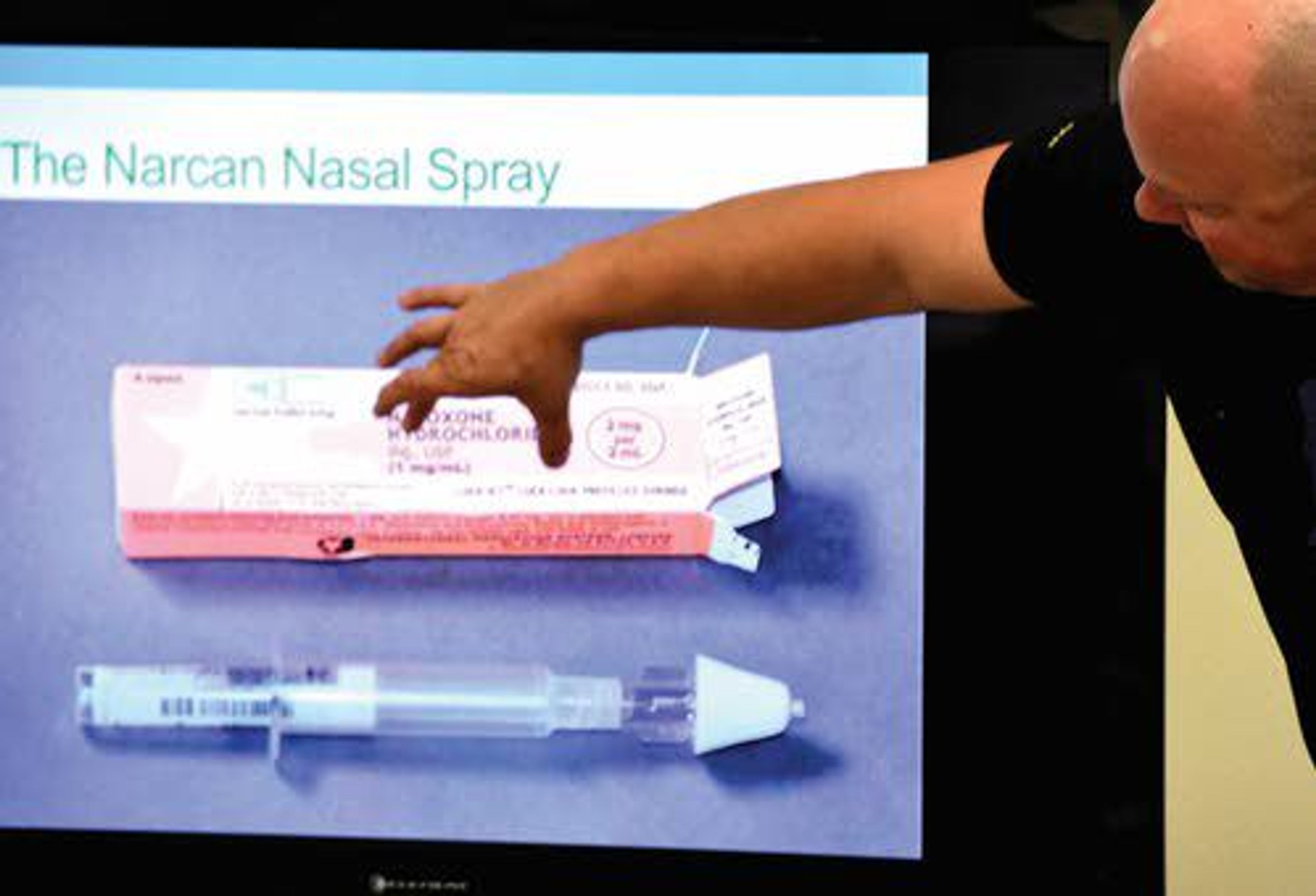 Jerid Hilderbrand, a paramedic with the Pullman Fire Department, describes a package of Narcan nasal spray to a group of Asotin law enforcement officers during Asotin County’s opiate response training on Wednesday at Asotin City Hall. The Asotin County Sheriff’s Department recently announced that deputies, along with officers in the Asotin Police Department, will now carry Narcan in the event of opiate overdoses.