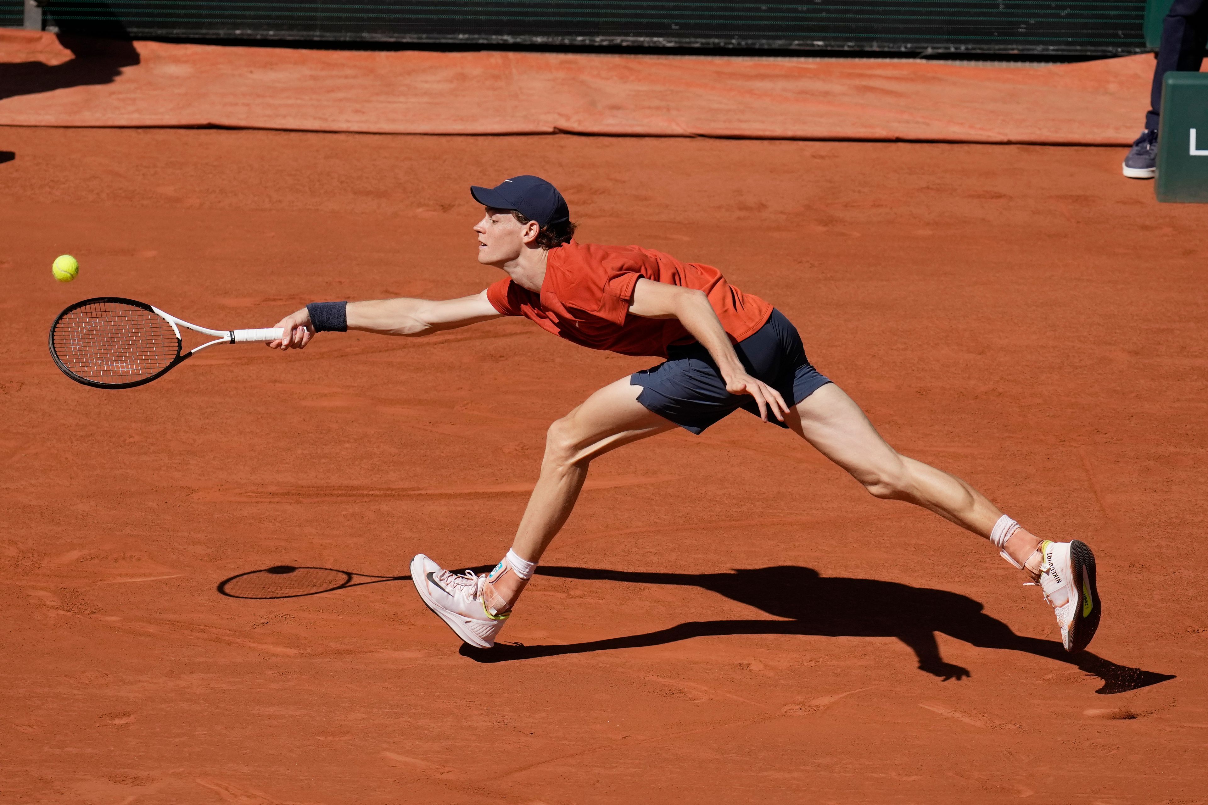 Italy's Jannik Sinner plays a shot against Spain's Carlos Alcaraz during their semifinal match of the French Open tennis tournament at the Roland Garros stadium in Paris, Friday, June 7, 2024.