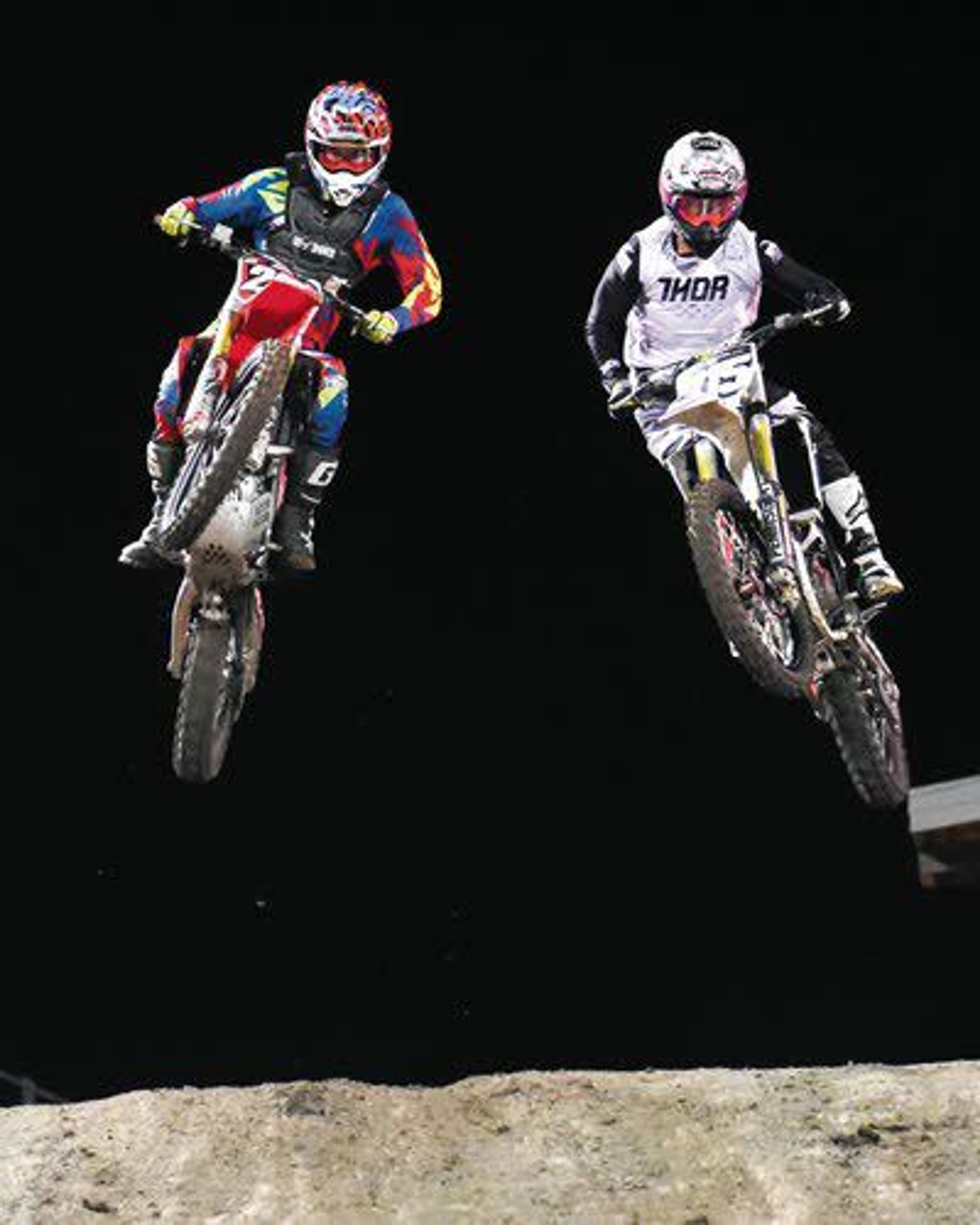 Braden Spangle of Spokane (left) and Kyle Russell of Seabeck, Wash., are neck and neck after the second lap of the 250cc pro main race Saturday night at the Lewiston Supercross at the Lewiston Roundup Grounds. Russell ended up winning the race.