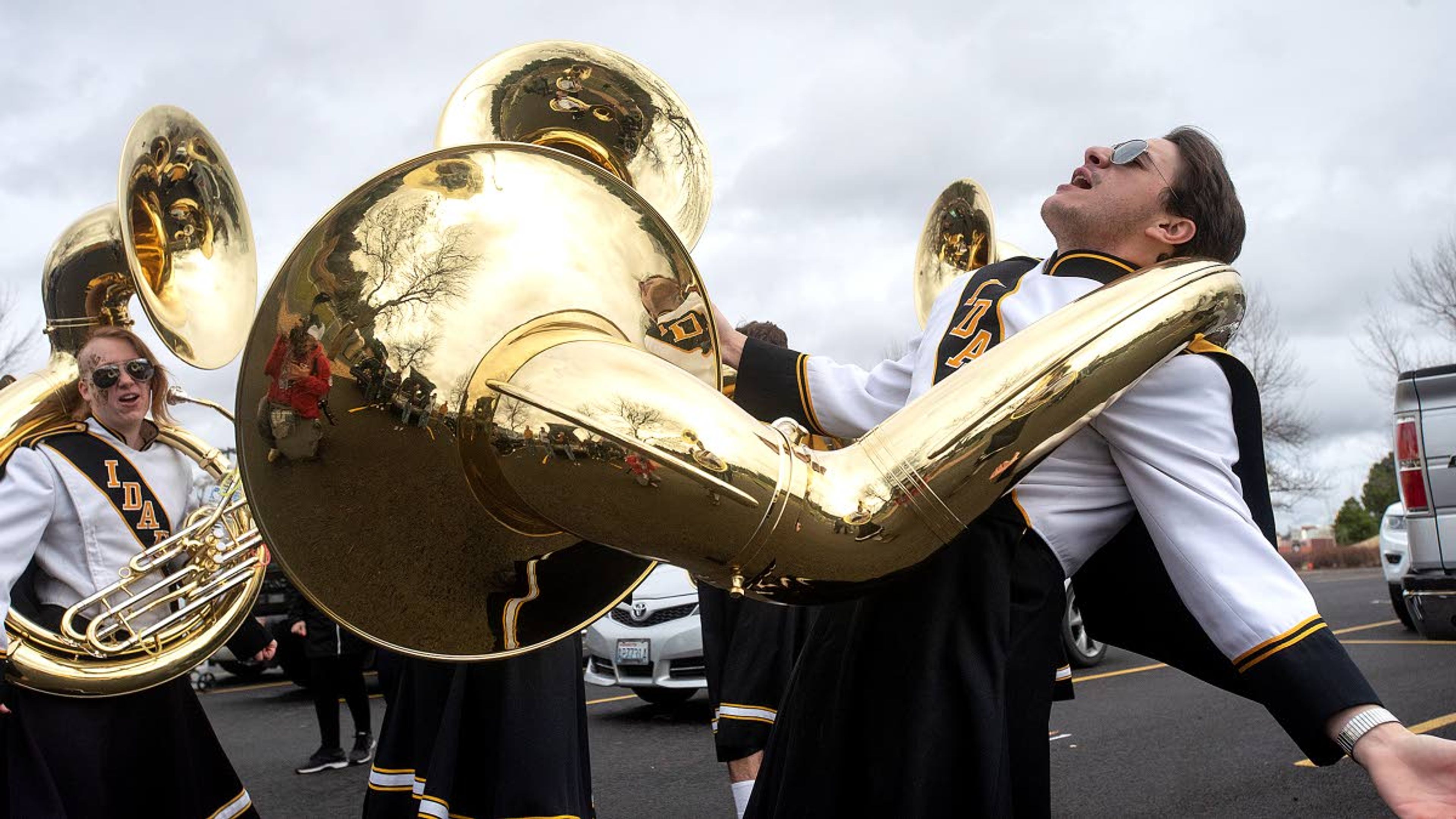 Tim Malm, a sophomore at the University of Idaho in Moscow, hams it up as he and his fellow Vandal Marching Band sousaphone players perform a rendition of “In Heaven There Is No Beer” in front of a football Saturday tailgate party Nov. 3.