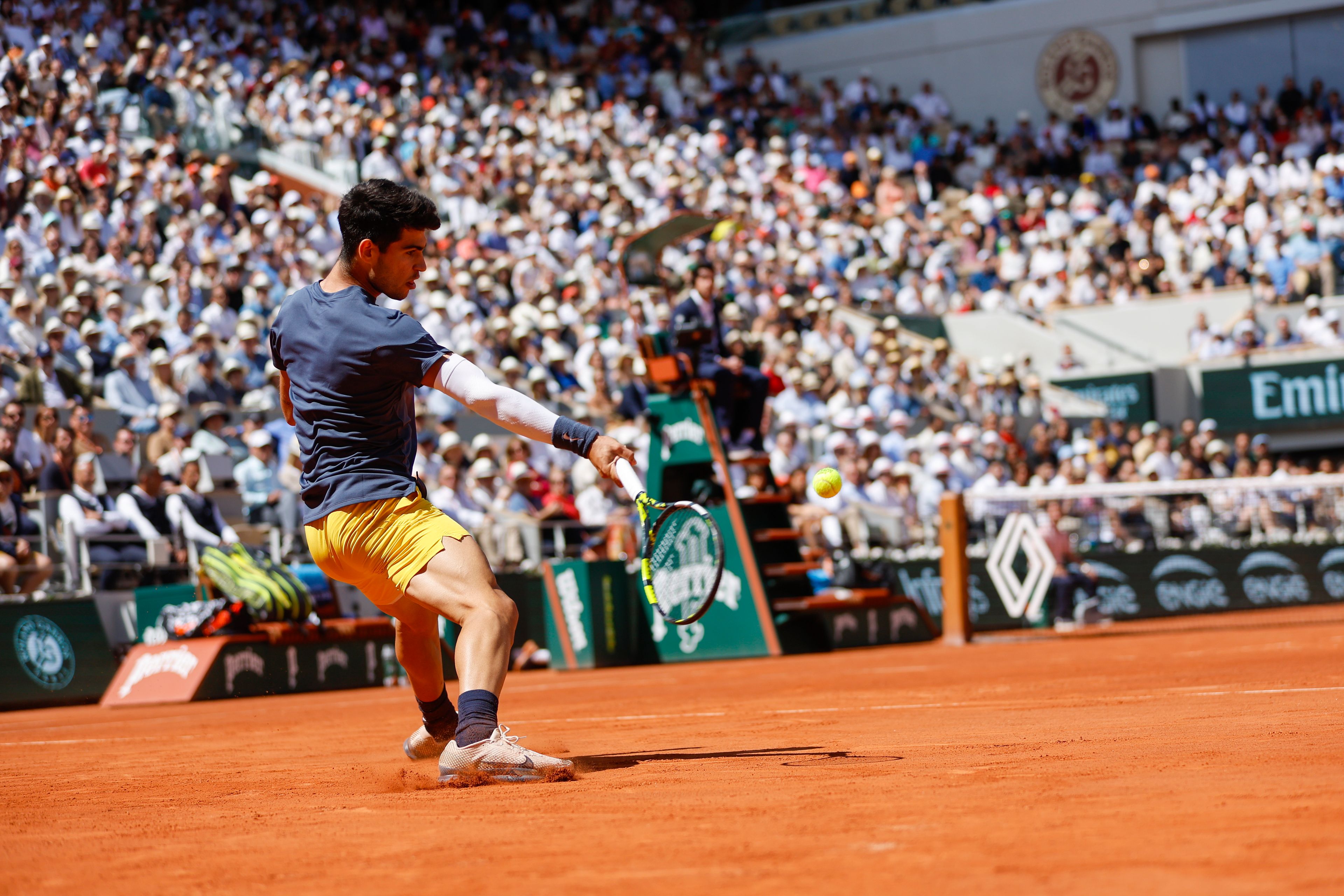 Spain's Carlos Alcaraz plays a shot against Germany's Alexander Zverev during the men's final of the French Open tennis tournament at the Roland Garros stadium in Paris, France, Sunday, June 9, 2024.