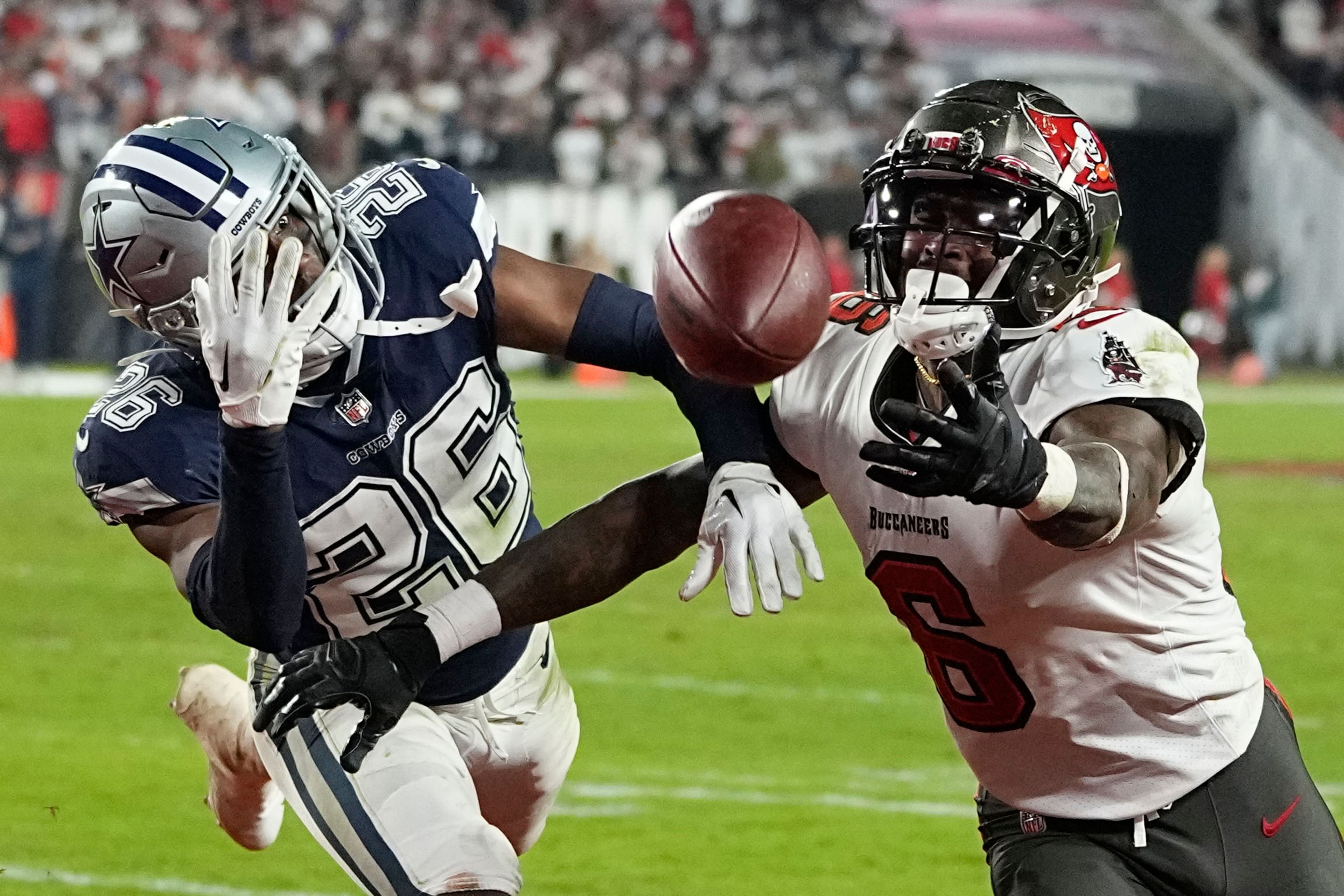 Dallas Cowboys cornerback DaRon Bland (26) deflects a pass intended for Tampa Bay Buccaneers wide receiver Julio Jones (6) during the second half of an NFL wild-card football game, Monday, Jan. 16, 2023, in Tampa, Fla. (AP Photo/Chris Carlson)