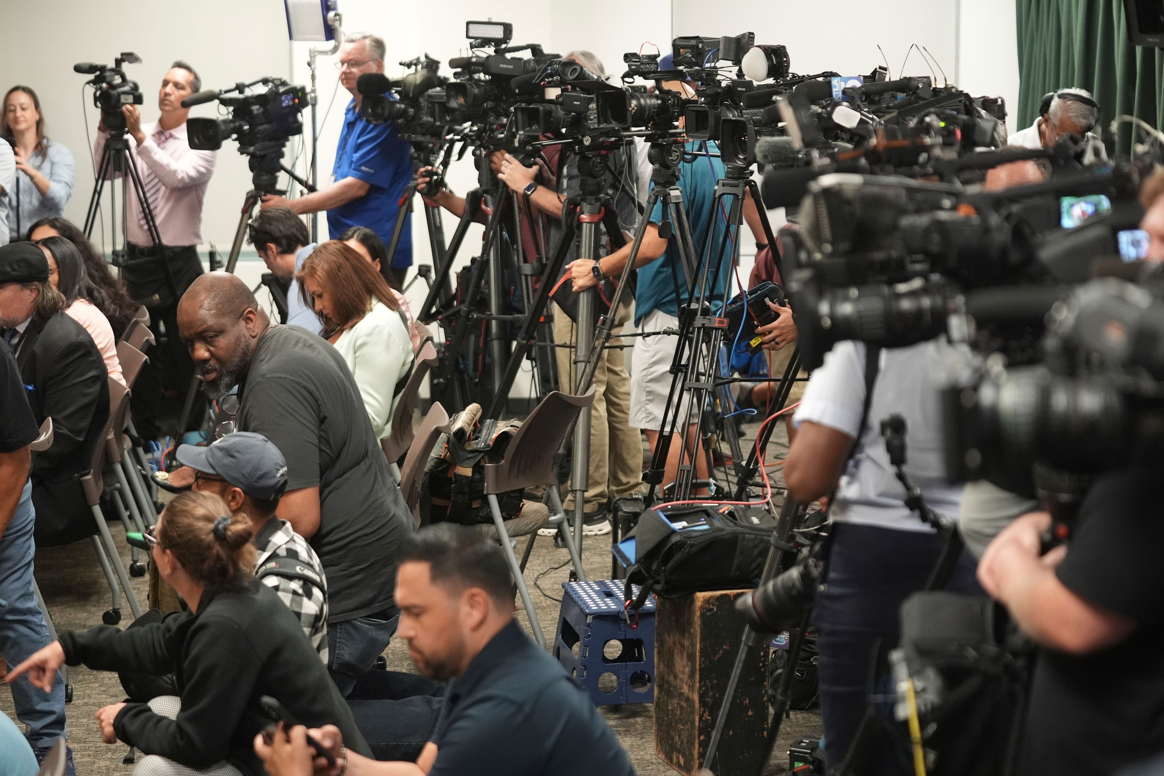 Media gather for a news conference being held by Los Angeles County District Attorney George Gascon on Thursday, Oct. 24, 2024, in Los Angeles. (AP Photo/Damian Dovarganes)