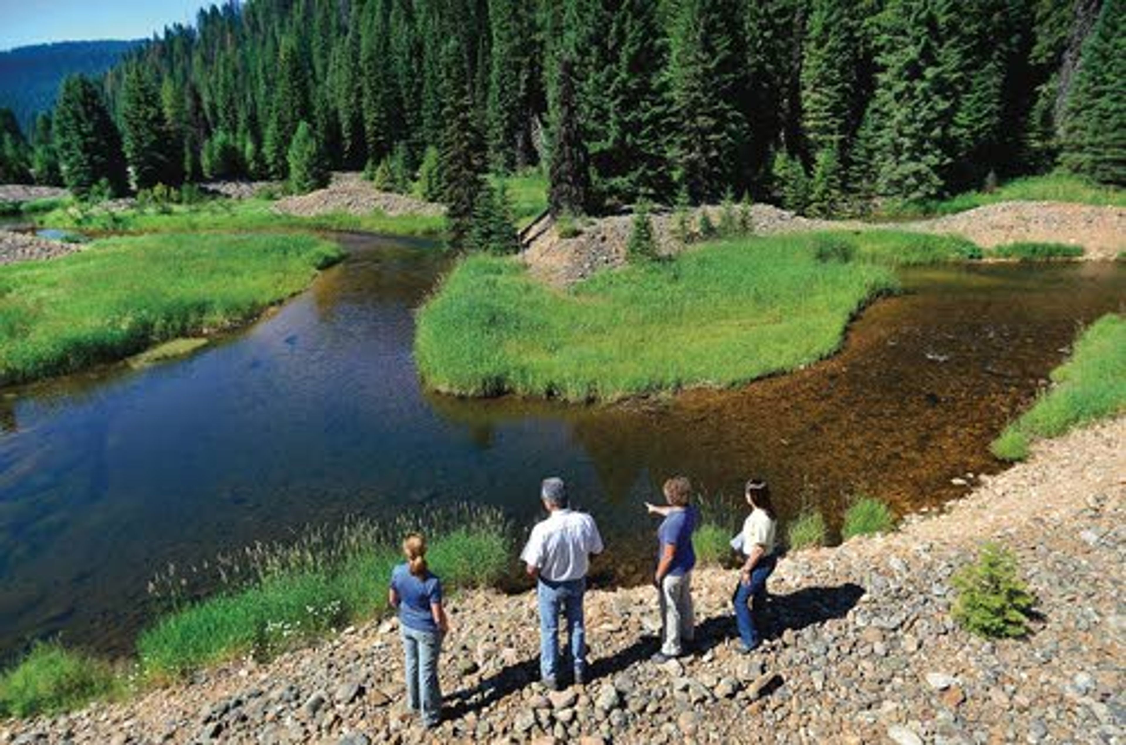 Officials with the Nez Perce Tribe’s fisheries and watersheds divisions and the Nez Perce-Clearwater National Forest look at the Crooked River and talk about their plan to fix fisheries and floodplain problems associated with dredge mining that took place from the 1930s to the ’50s.