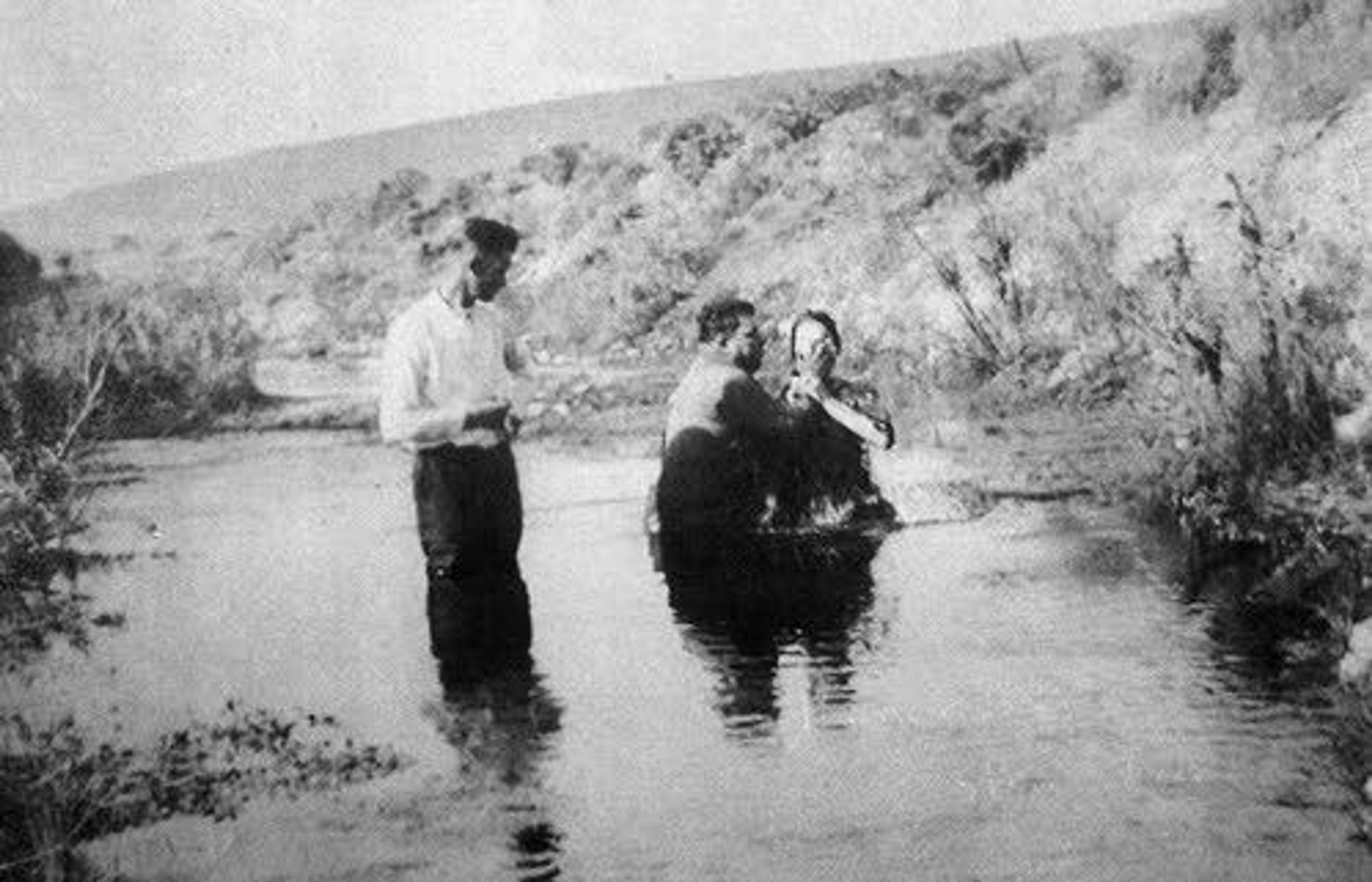 A member of the Lewiston Church of Christ is baptized in a local waterway.