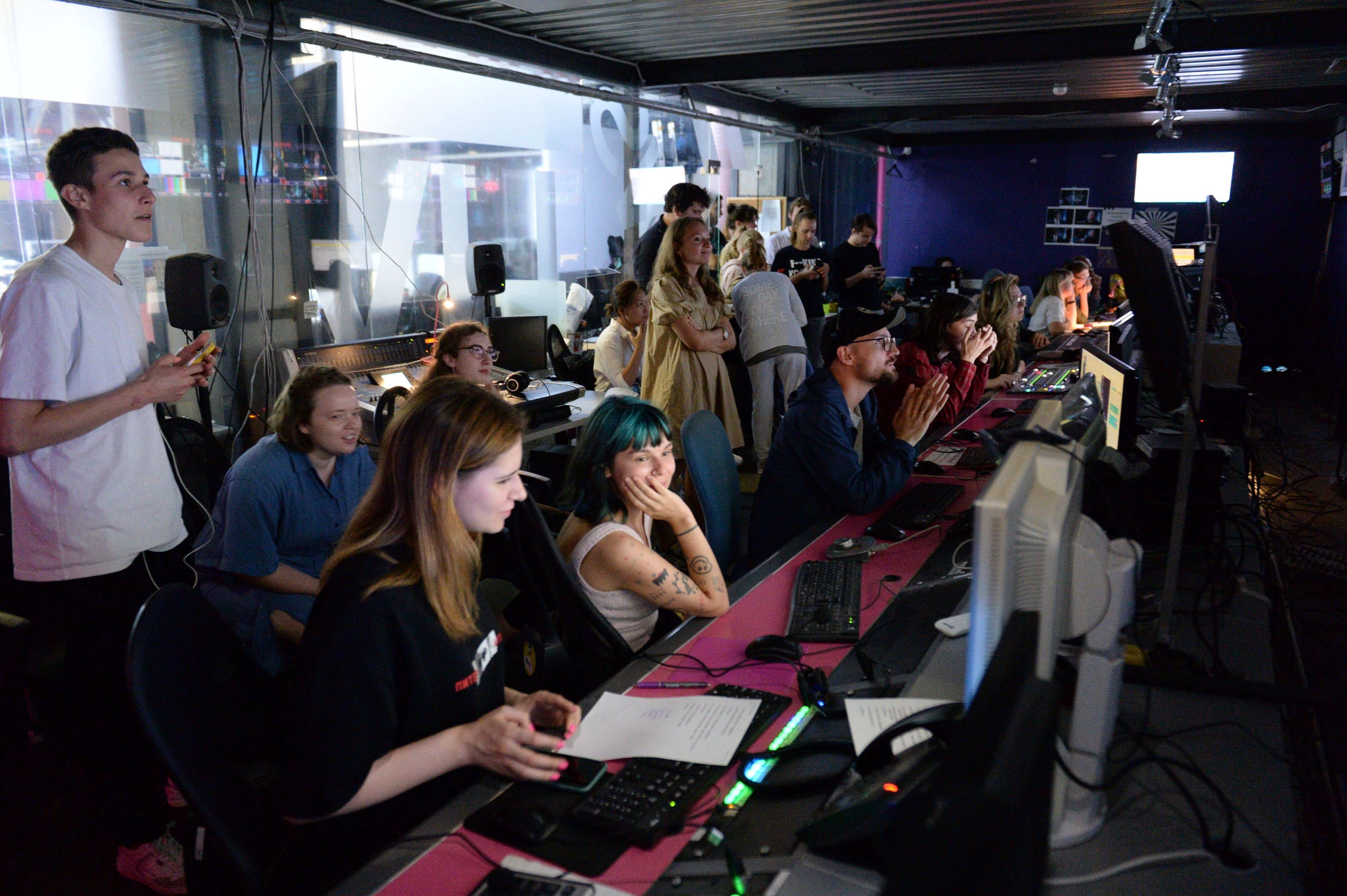 FILE - Journalists work in a news room of the Dozhd (Rain) TV channel in Moscow, Russia, Friday, Aug. 20, 2021. In 2014, Russian cable networks dropped Dozhd, the county's sole independent TV channel, after it hosted a history program on the 1941-44 Siege of Leningrad and asked viewers to vote on whether Soviet authorities should have surrendered Leningrad to save lives. The question caused an uproar, with officials accusing the channel of crossing moral and ethical lines and calling for its shutdown. (AP Photo/Denis Kaminev, File)