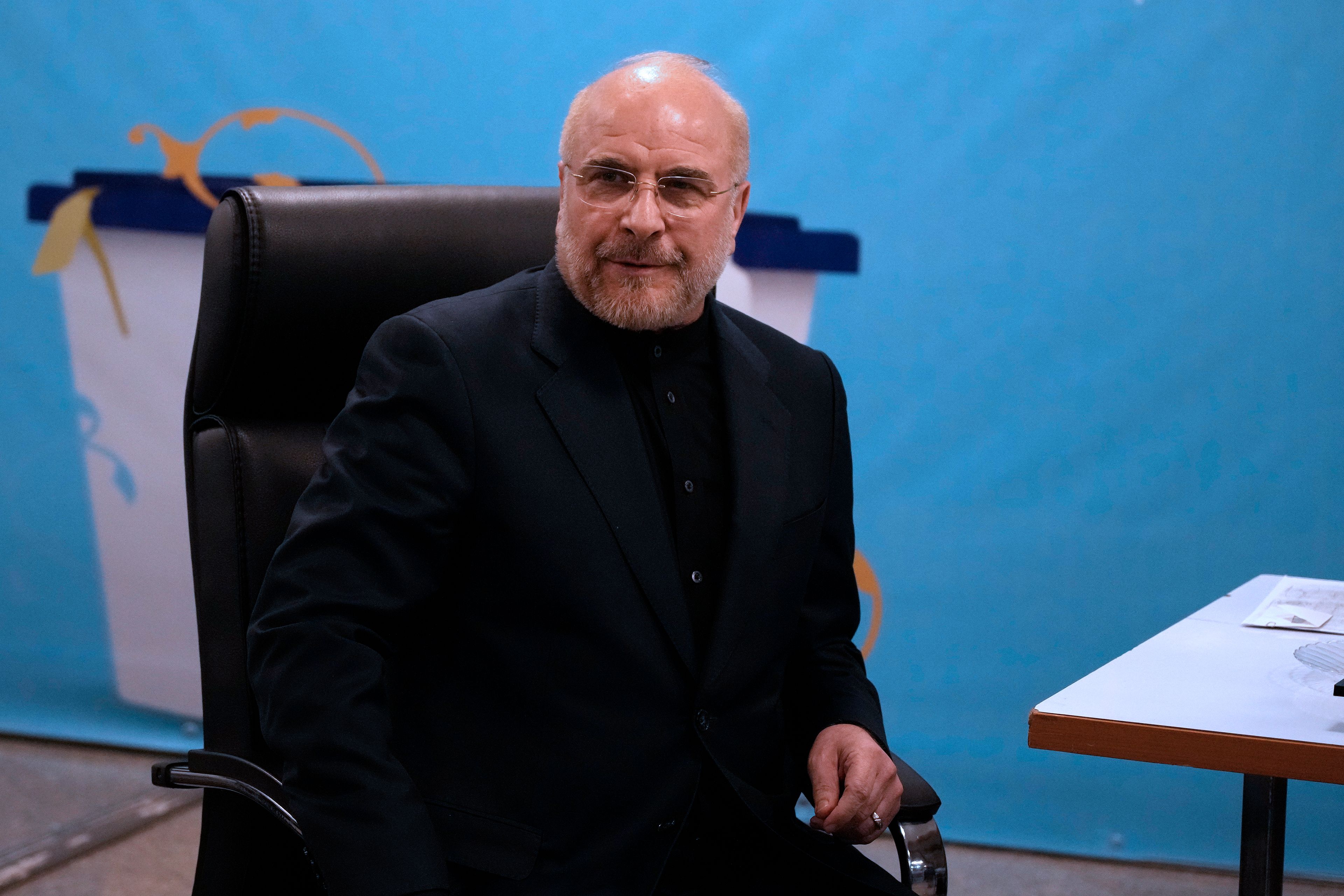 Iran's hard-line parliament speaker Mohammad Bagher Qalibaf sits while registering his name as a candidate for the June 28 presidential election at the Interior Ministry, in Tehran, Iran, Monday, June 3, 2024. Iran's Guardian Council on Sunday, June, 9, approved the country's hard-line parliament speaker and five others to run in the country's presidential election following a helicopter crash that killed President Ebrahim Raisi and seven others.