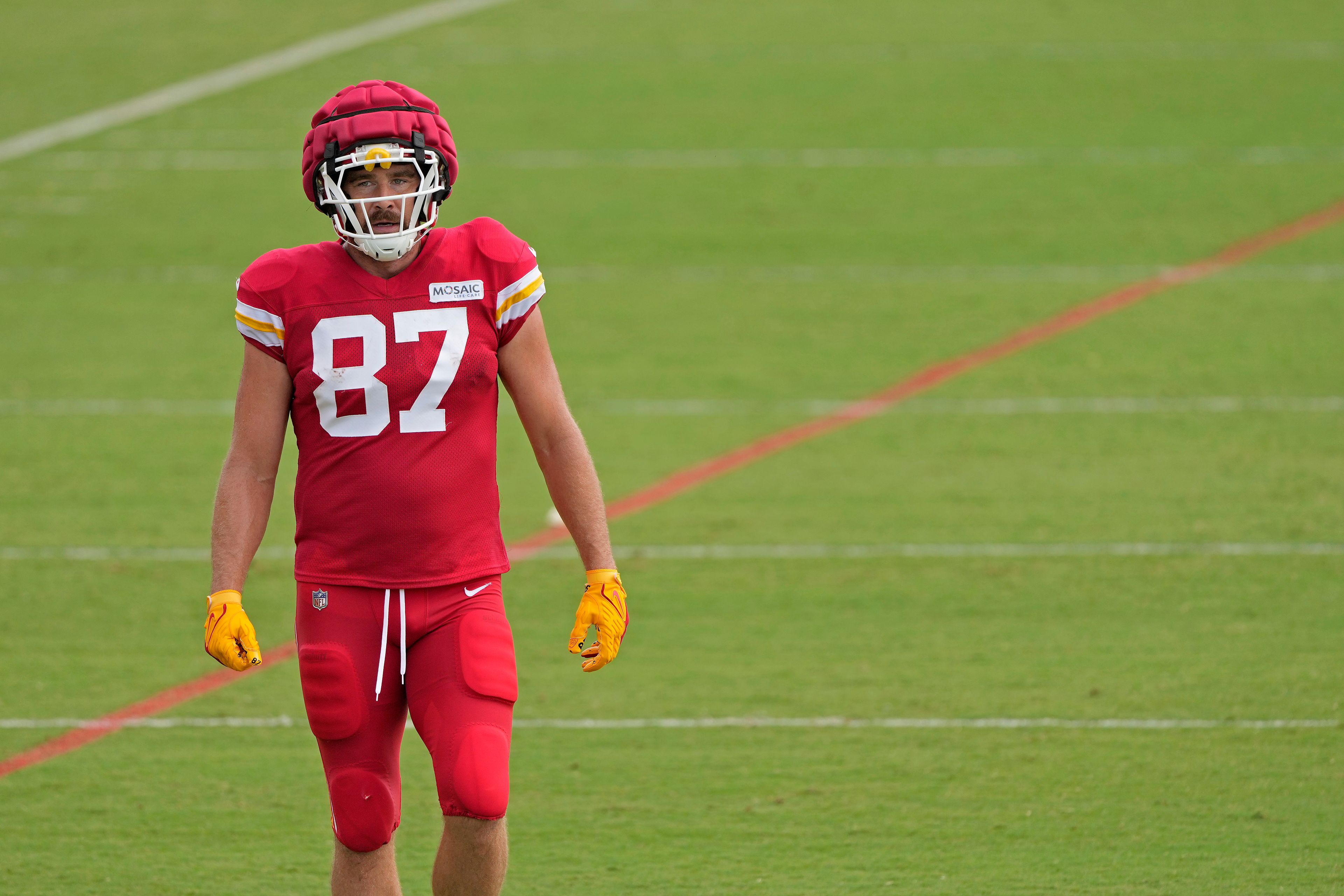 Kansas City Chiefs tight end Travis Kelce waits to take part in a drill at NFL football training camp Wednesday, Aug. 14, 2024, in St. Joseph, Mo.