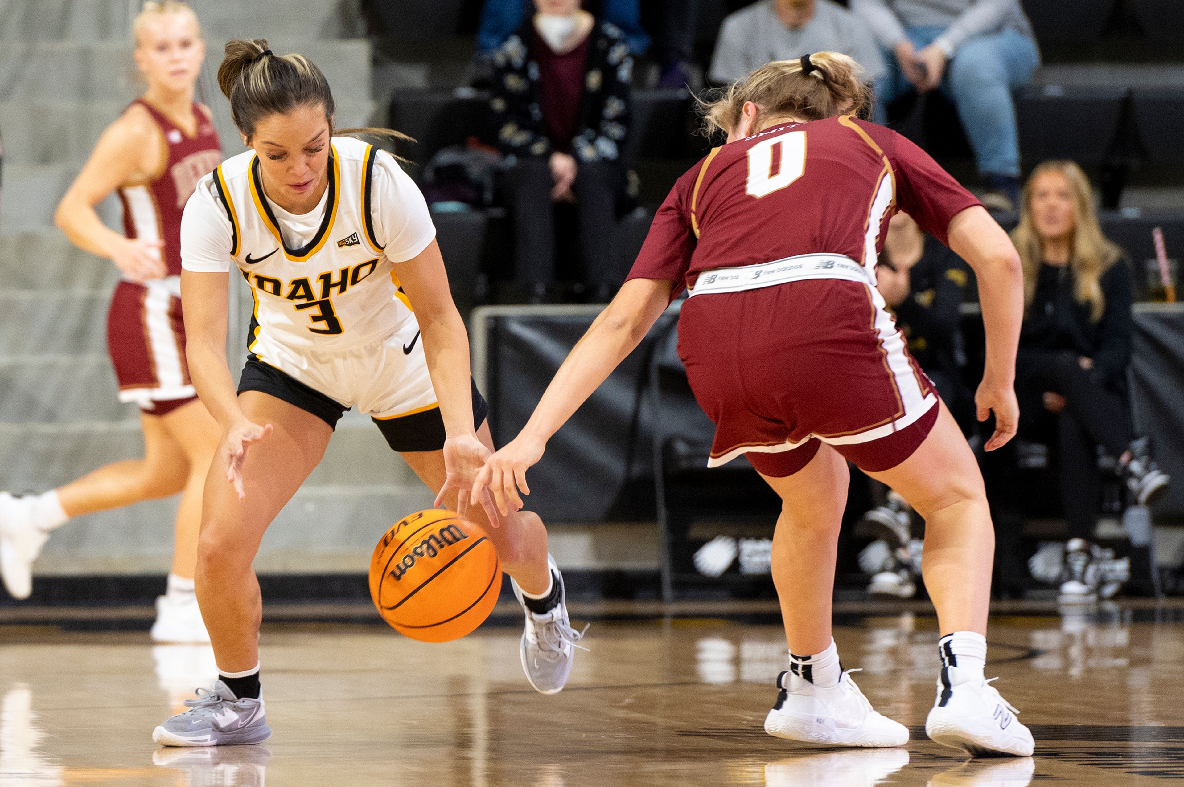 Idaho guard Ashlyn Wallace, left, a former Clarkston standout, steals the ball from Denver guard Emma Smith during the first quarter of a Dec. 15 nonconference game at Idaho Central Credit Union Arena.