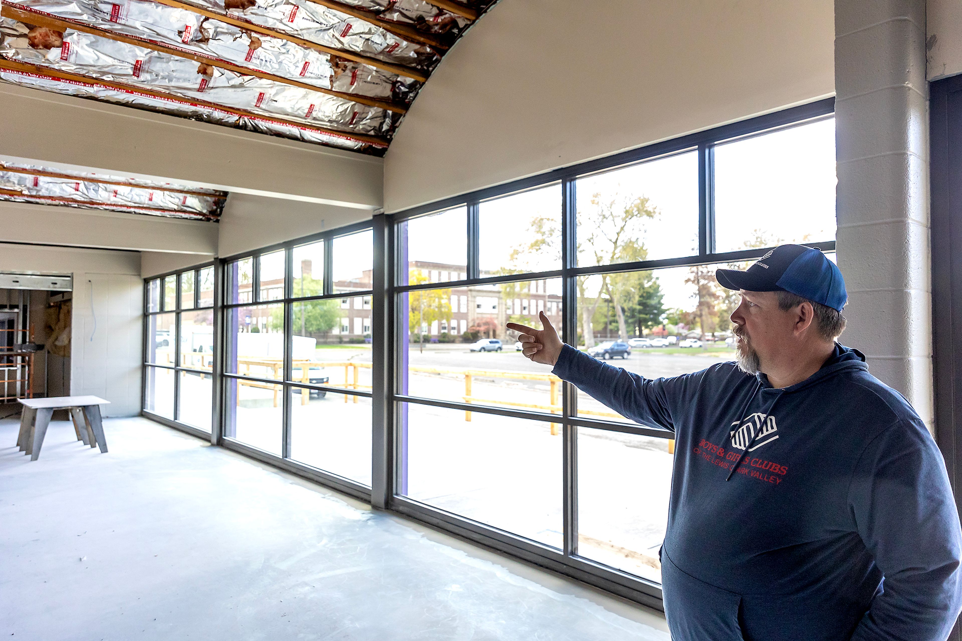 Jon Evans stands in the new entryway as renovations for the Boys and Girls Club continues at Booth Hall Wednesday in Lewiston.