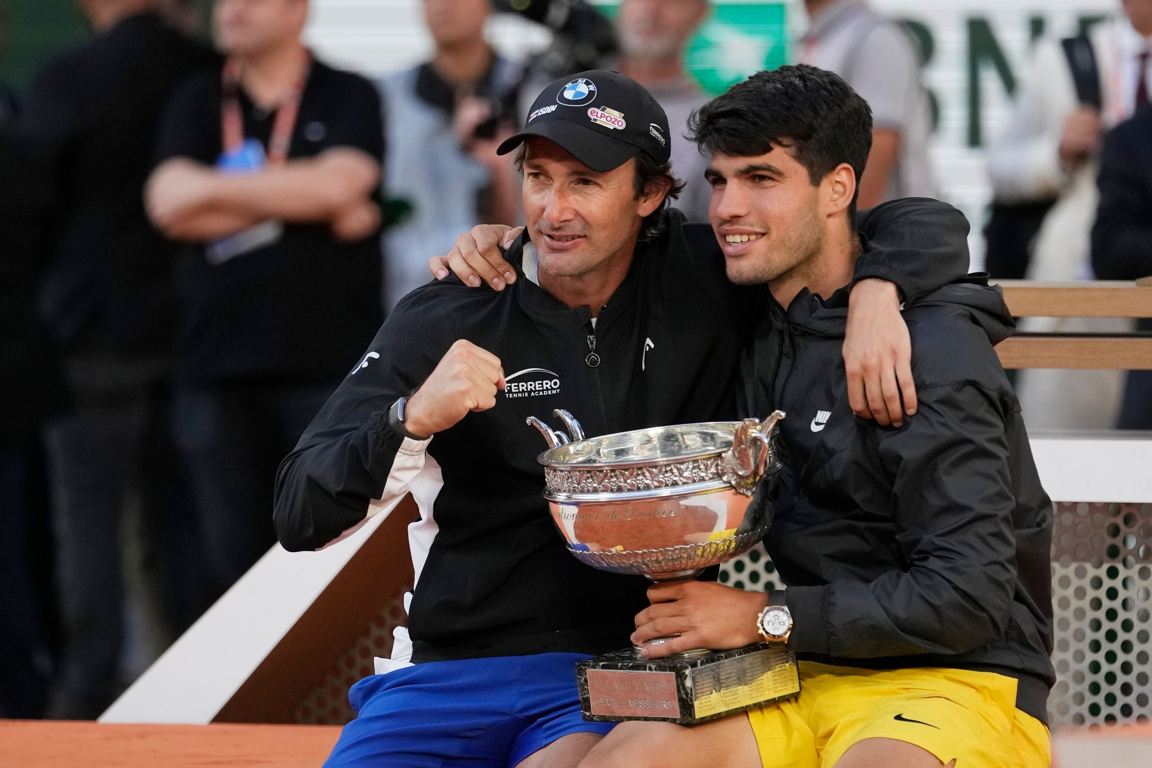 Winner Spain's Carlos Alcaraz, right, poses for a picture with his coach Juan Carlos Ferrero after the men's final match of the French Open tennis tournament against Germany's Alexander Zverev at the Roland Garros stadium in Paris, Sunday, June 9, 2024.