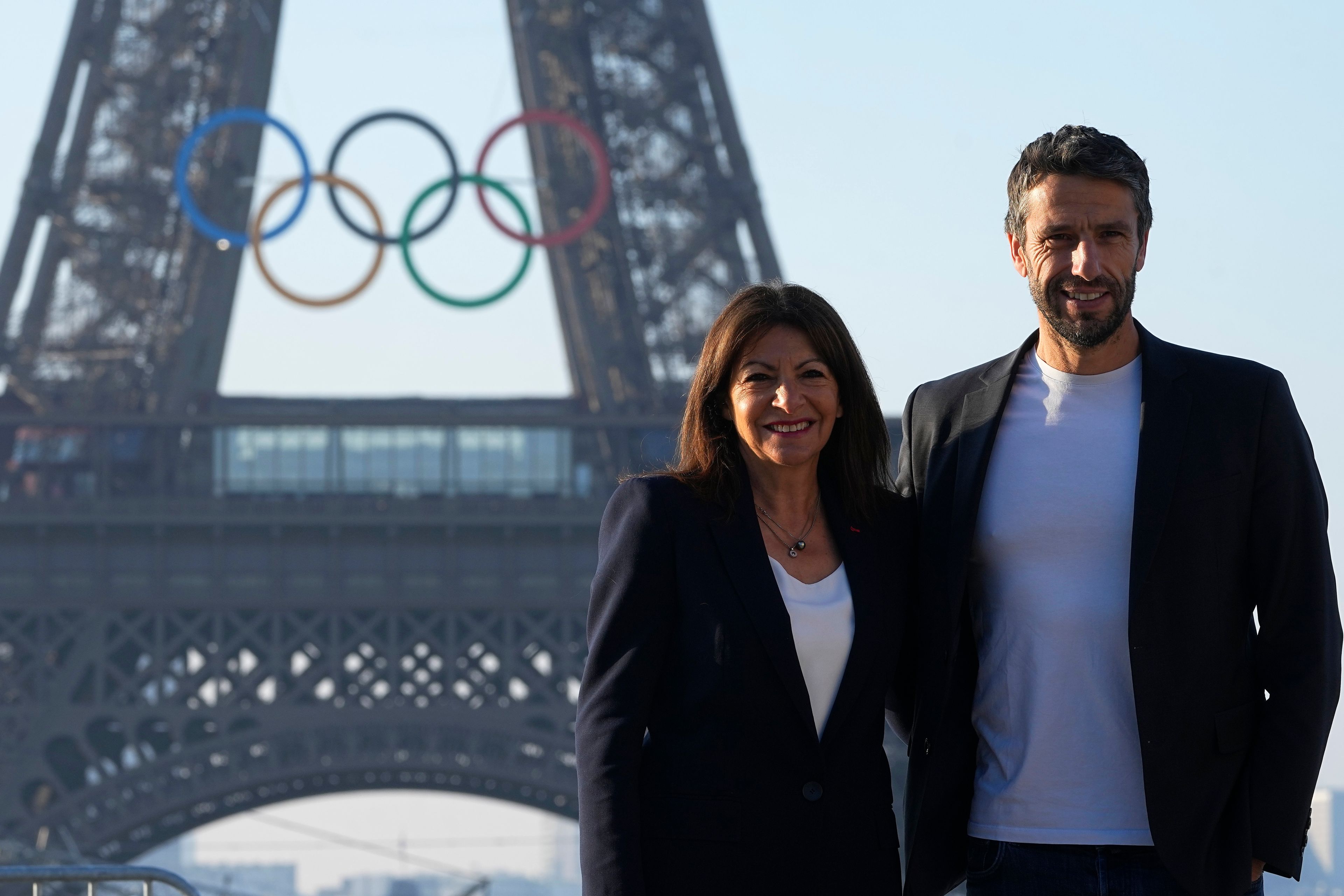 Paris mayor Anne Hidalgo and head of Paris 2024 Olympics Tony Estanguet pose in front of the Eiffel Tower Friday, June 7, 2024 in Paris. The Paris Olympics organizers mounted the rings on the Eiffel Tower on Friday as the French capital marks 50 days until the start of the Summer Games. The 95-foot-long and 43-foot-high structure of five rings, made entirely of recycled French steel, will be displayed on the south side of the 135-year-old historic landmark in central Paris, overlooking the Seine River.