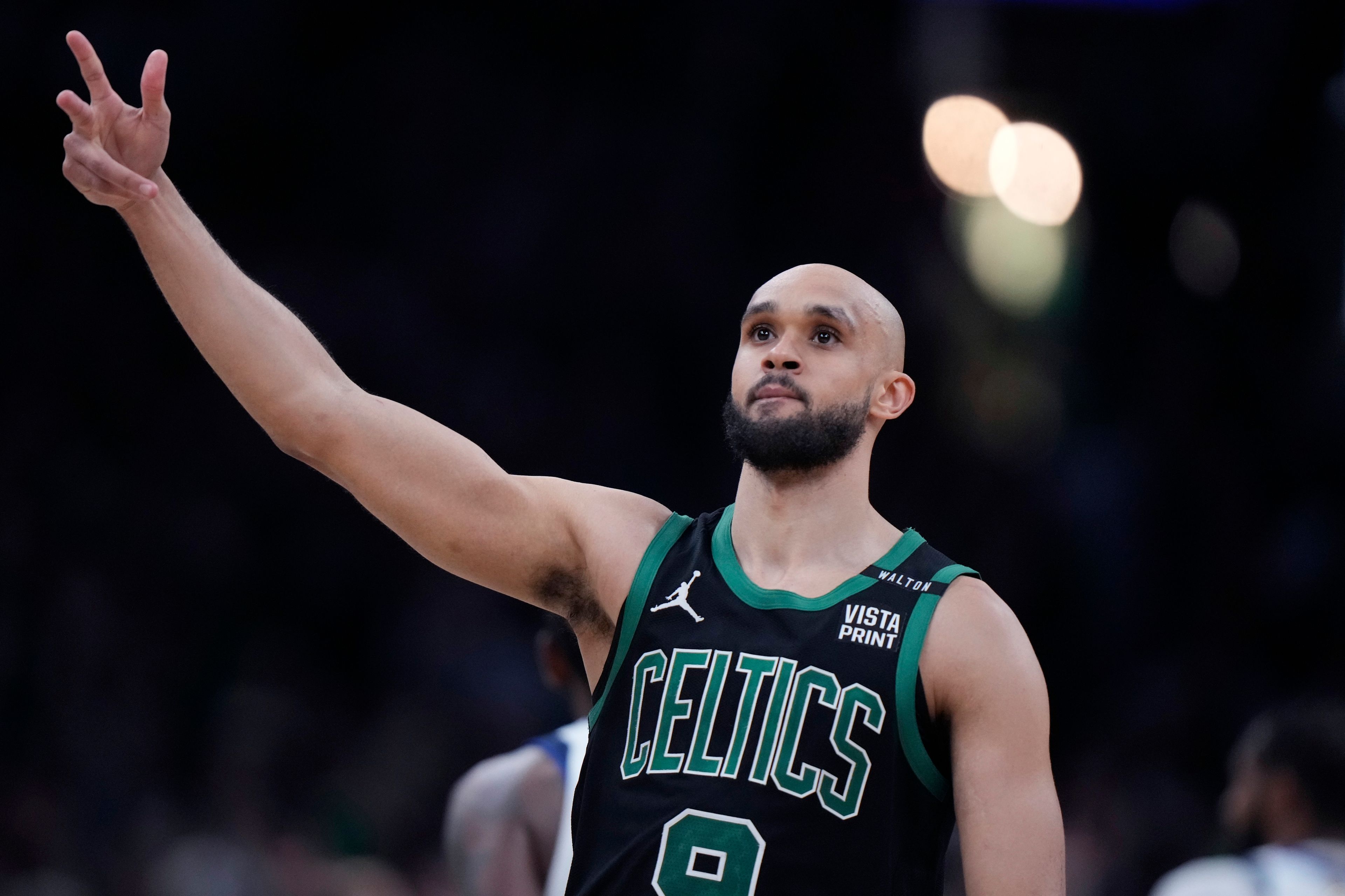 Boston Celtics guard Derrick White celebrates after hitting a 3-pointer against the Dallas Mavericks during the second half of Game 2 of the NBA Finals basketball series, Sunday, June 9, 2024, in Boston.