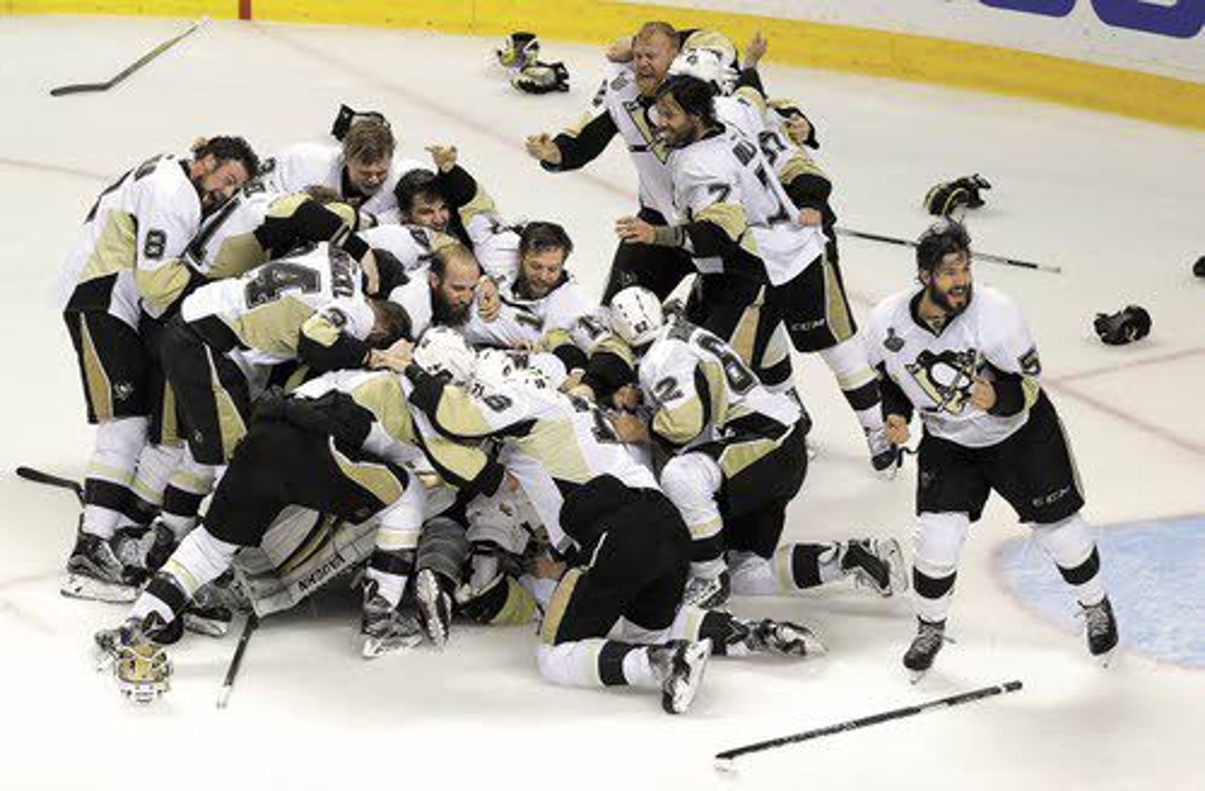 Pittsburgh players dogpile after beating the San Jose Sharks to claim the Stanley Cup Finals on Sunday in San Jose, Calif. , Sunday, June 12, 2016. The Penguins won 3-1 to win the series 4-2. (AP Photo/Eric Risberg)