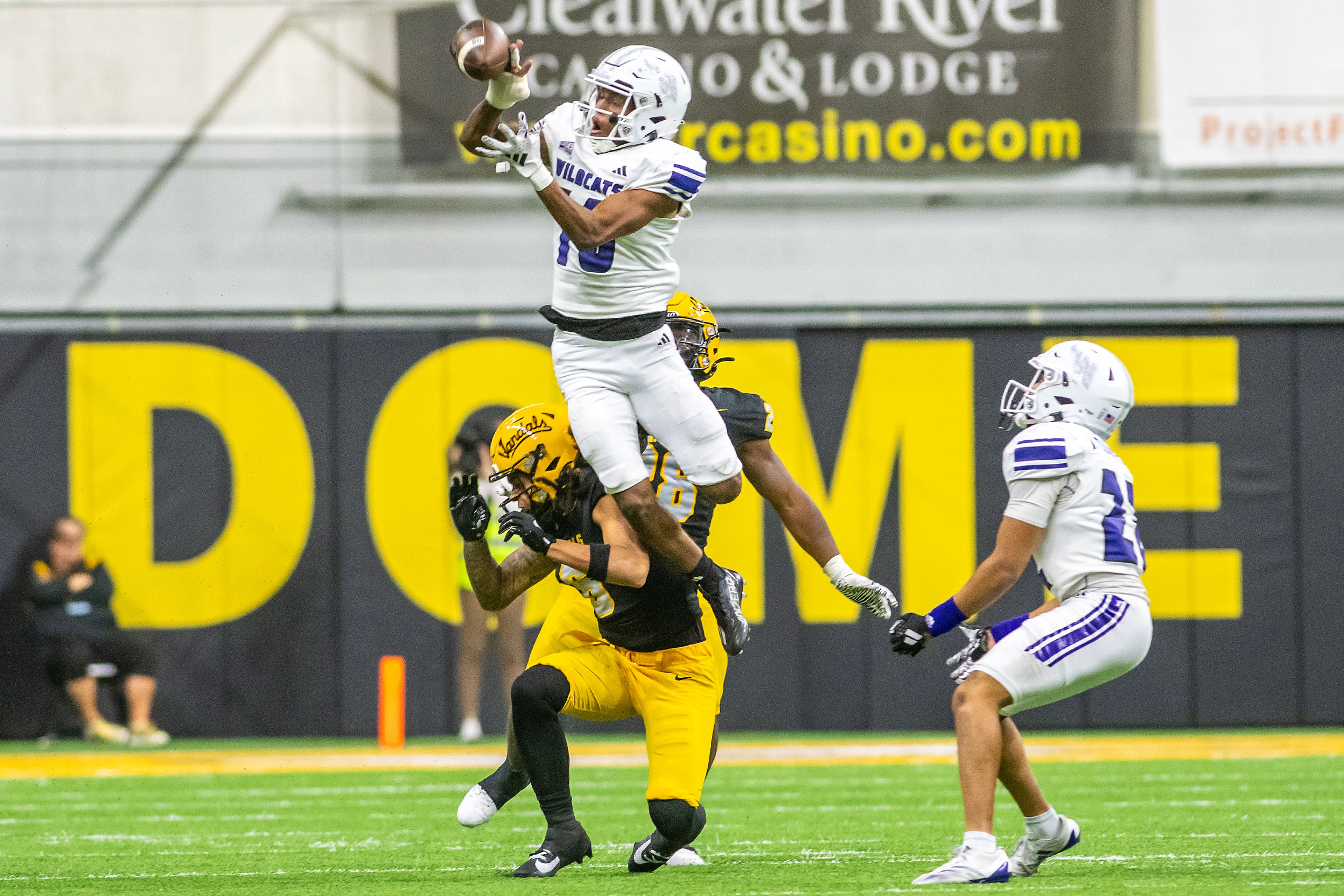 Weber State cornerback Toddrick Dixon breaks up a pass intended for Idaho wide receiver Jordan Dwyer which was then caught by his teammate Weber State cornerback Ishaan Daniels (right) during a quarter of a Big Sky conference game Saturday at the P1FCU Kibbie Dome in Moscow.