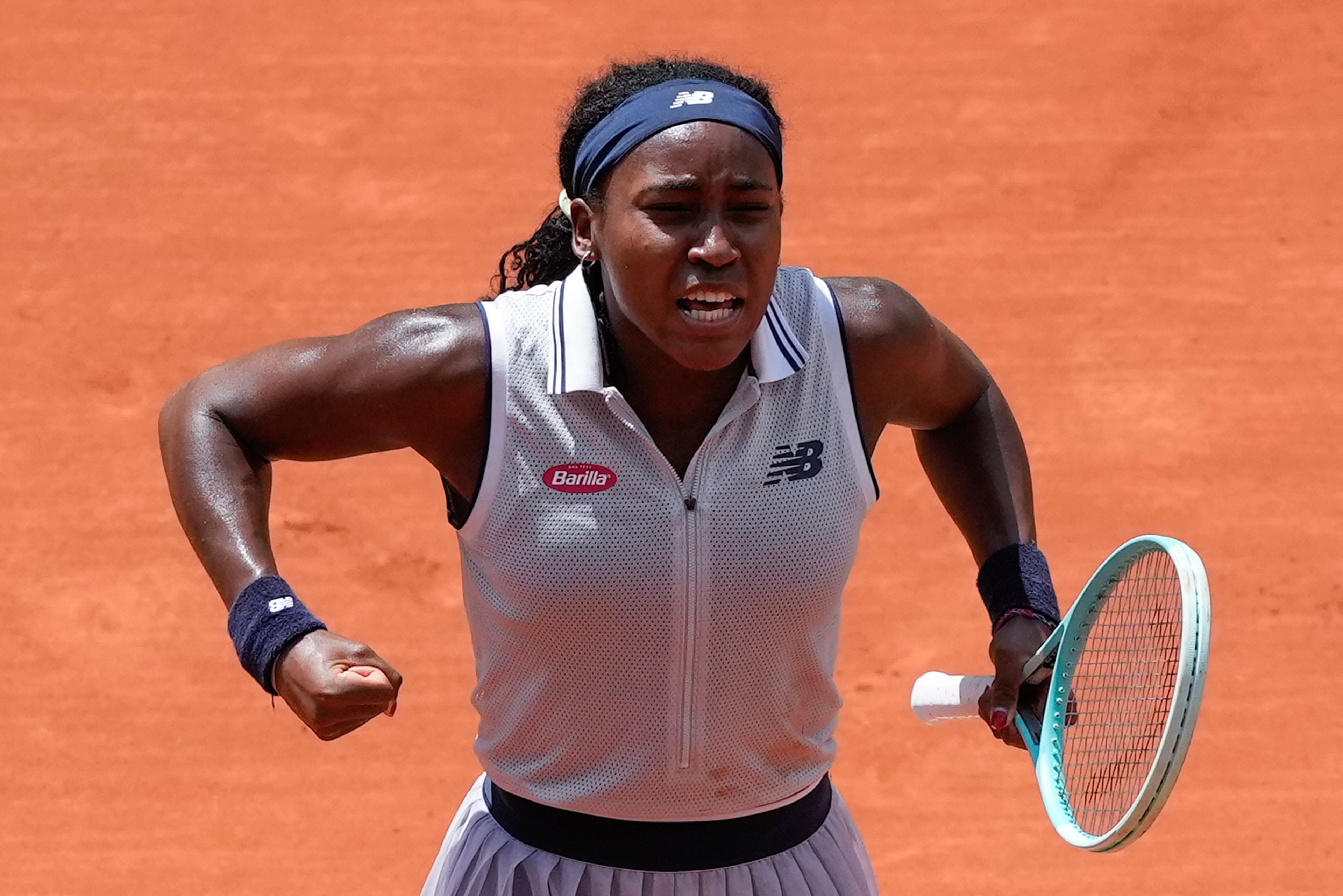 Coco Gauff of the U.S. celebrates winning her quarterfinal match of the French Open tennis tournament against Tunisia's Ons Jabeur at the Roland Garros stadium in Paris, Tuesday, June 4, 2024.