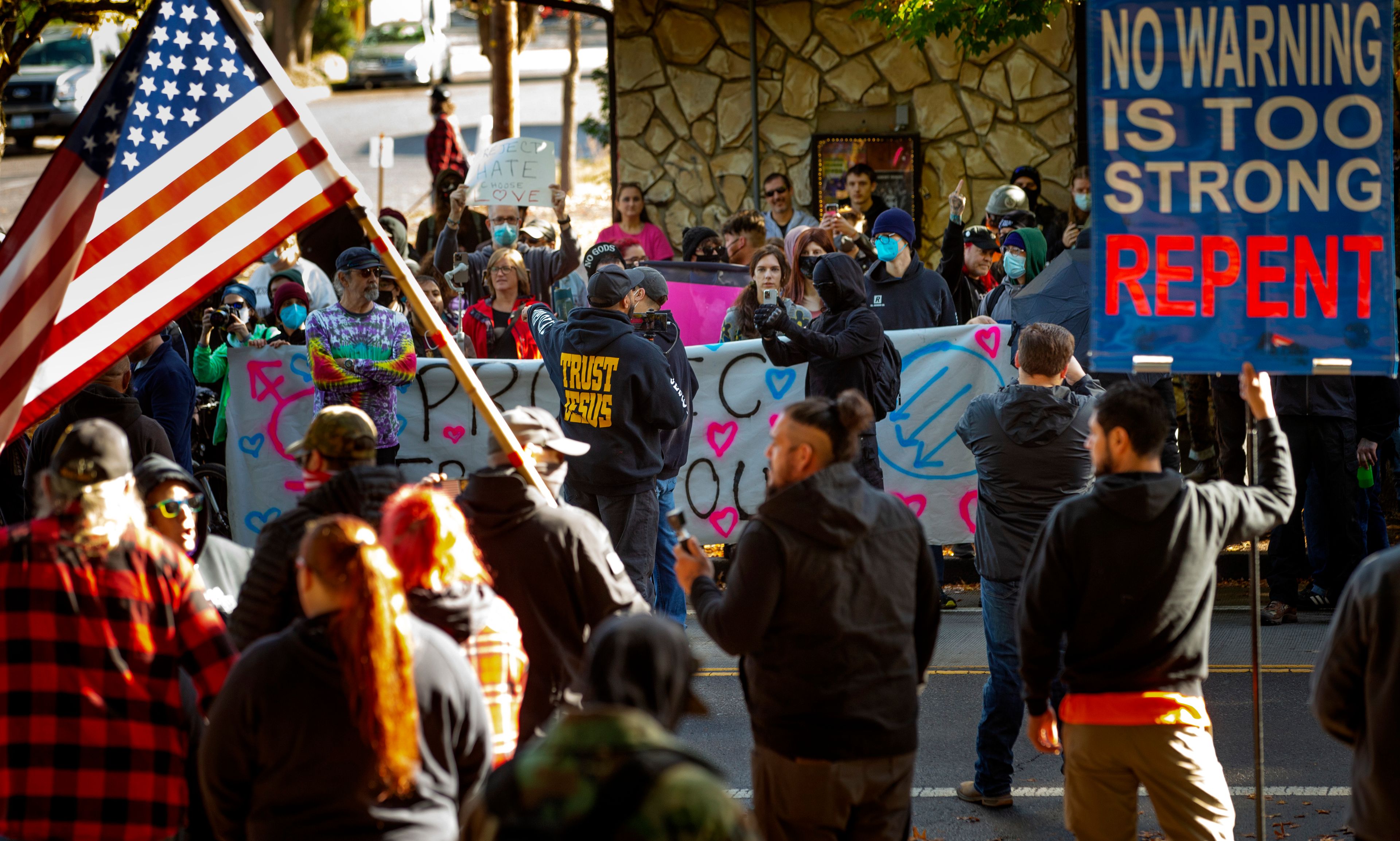 FILE - Protesters and supporters of a drag queen story time event square off in front of Old Nick's pub in Eugene, Ore., Oct. 23, 2022. About 10 drag artists from around the United States are banding together to protect and promote their art form. Qommittee announced its formation Wednesday, May 29, 2024 ahead of June’s LGBTQ+ Pride Month.