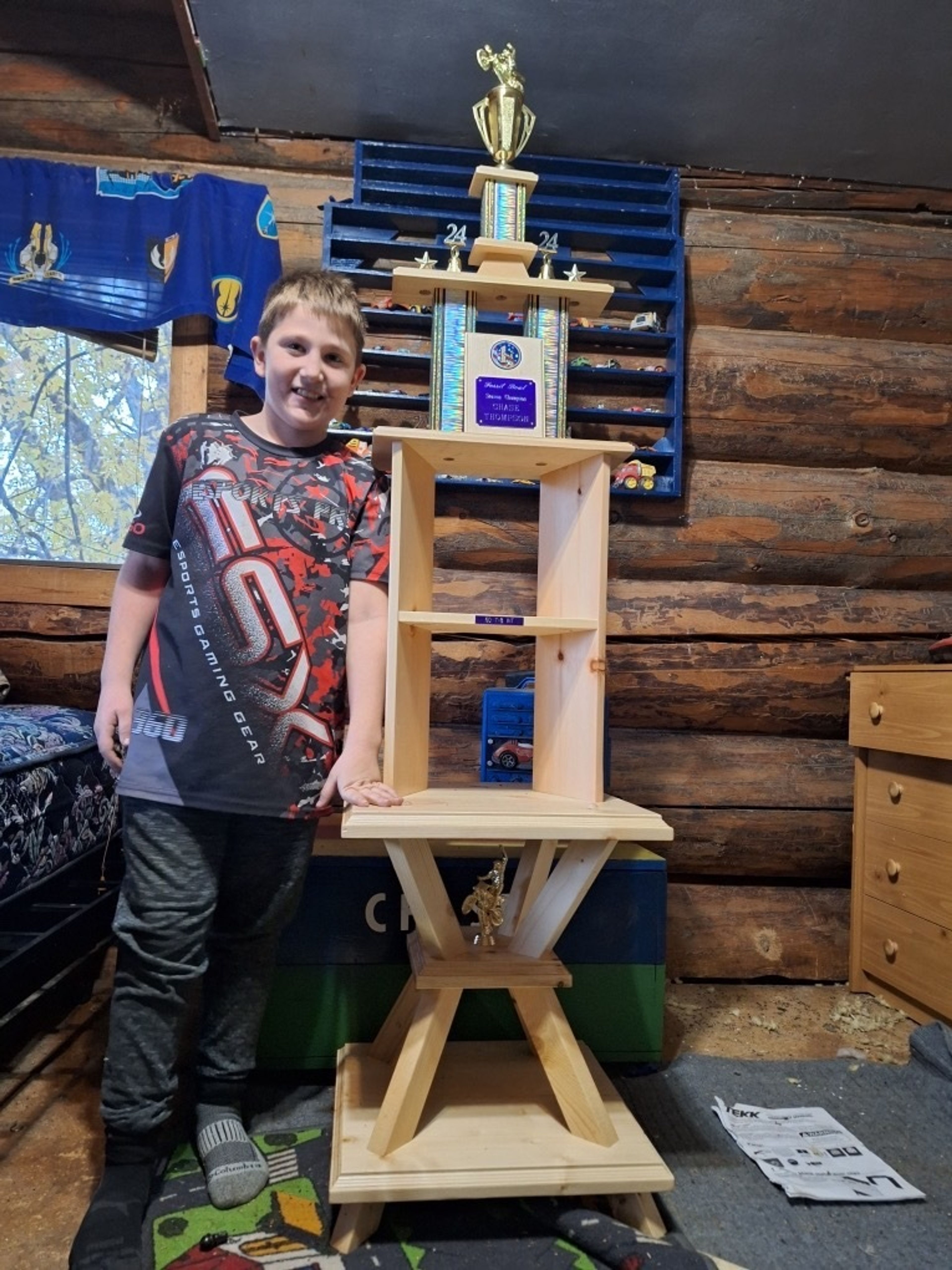 Chase Thompson, seen here with a trophy for motorcycle racing, recently saved his mother's life with quick action after she had a stroke at the family's home in Orofino.