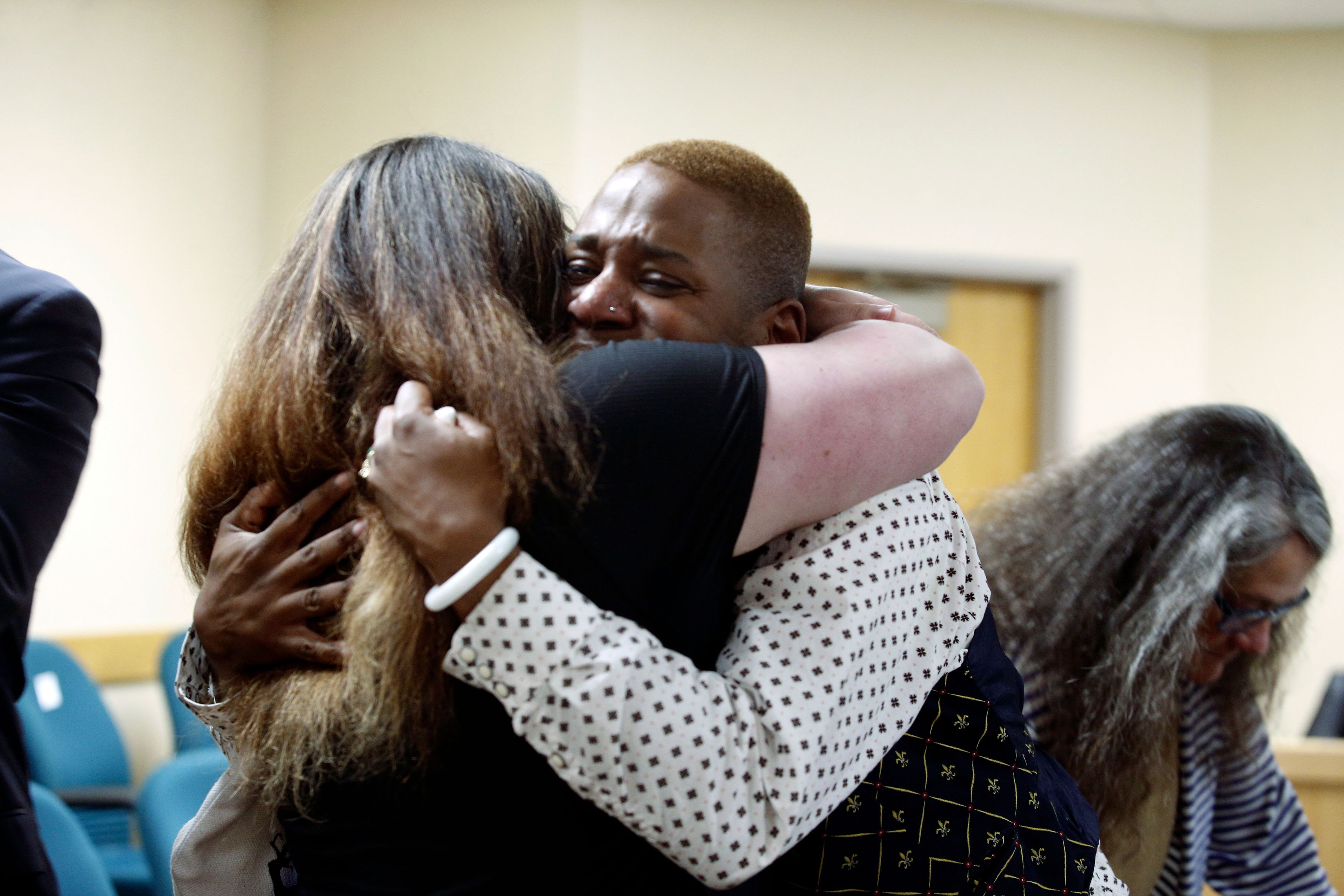 FILE - Eric Posey, of Post Falls, Idaho, embraces a supporter in court after a jury awarded him more than $1.1 million in damages in his defamation lawsuit against conservative blogger Summer Bushnell, May 24, 2024, in Coeur D'Alene, Idaho. Posey said he suffered harassment and death threats after Bushnell falsely accused him of exposing himself to minors during a performance in 2022.