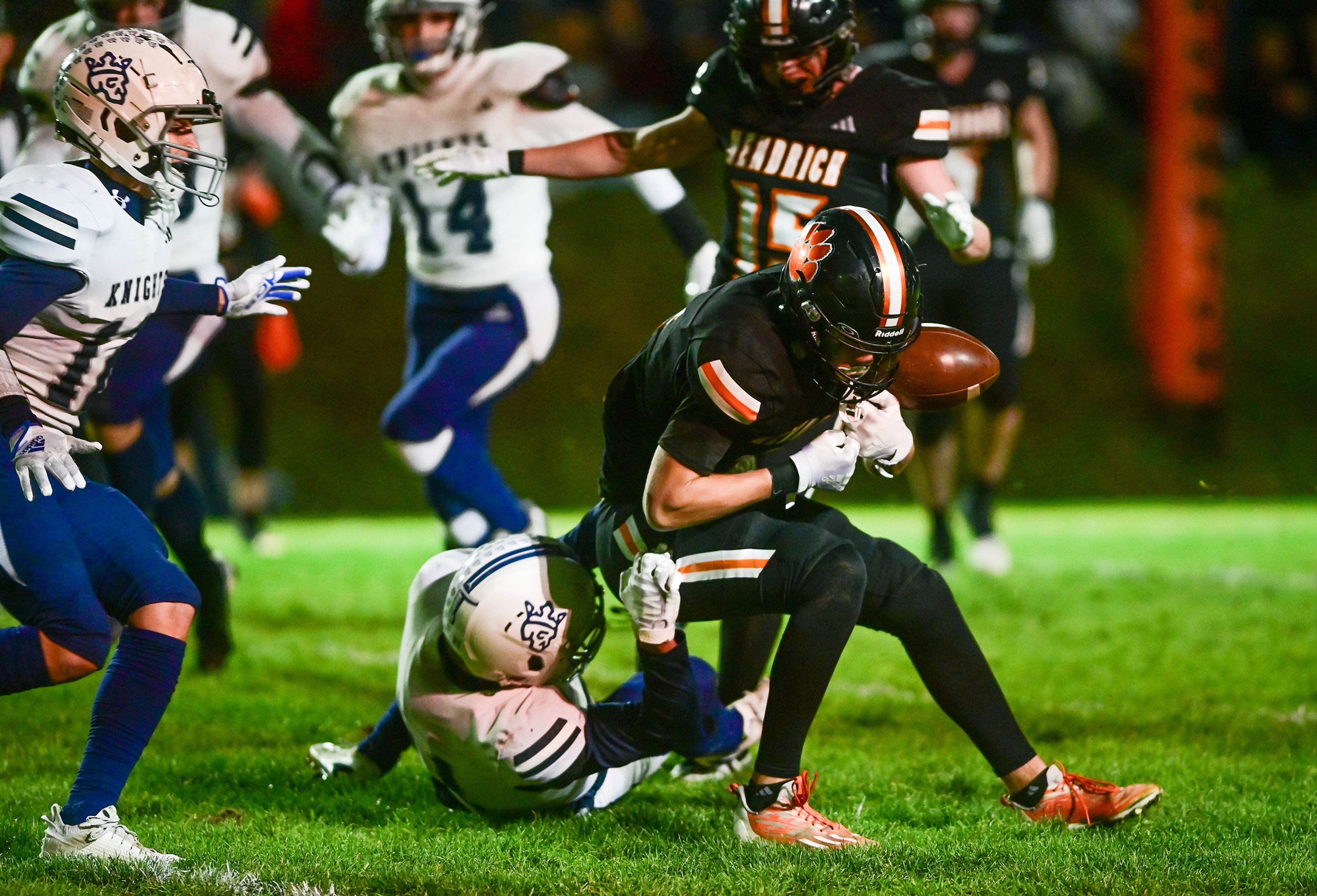 Kendricks Ralli Roetcisoender loses control of the ball as he is tackled by Logos Baxter Covington Friday in Kendrick.,