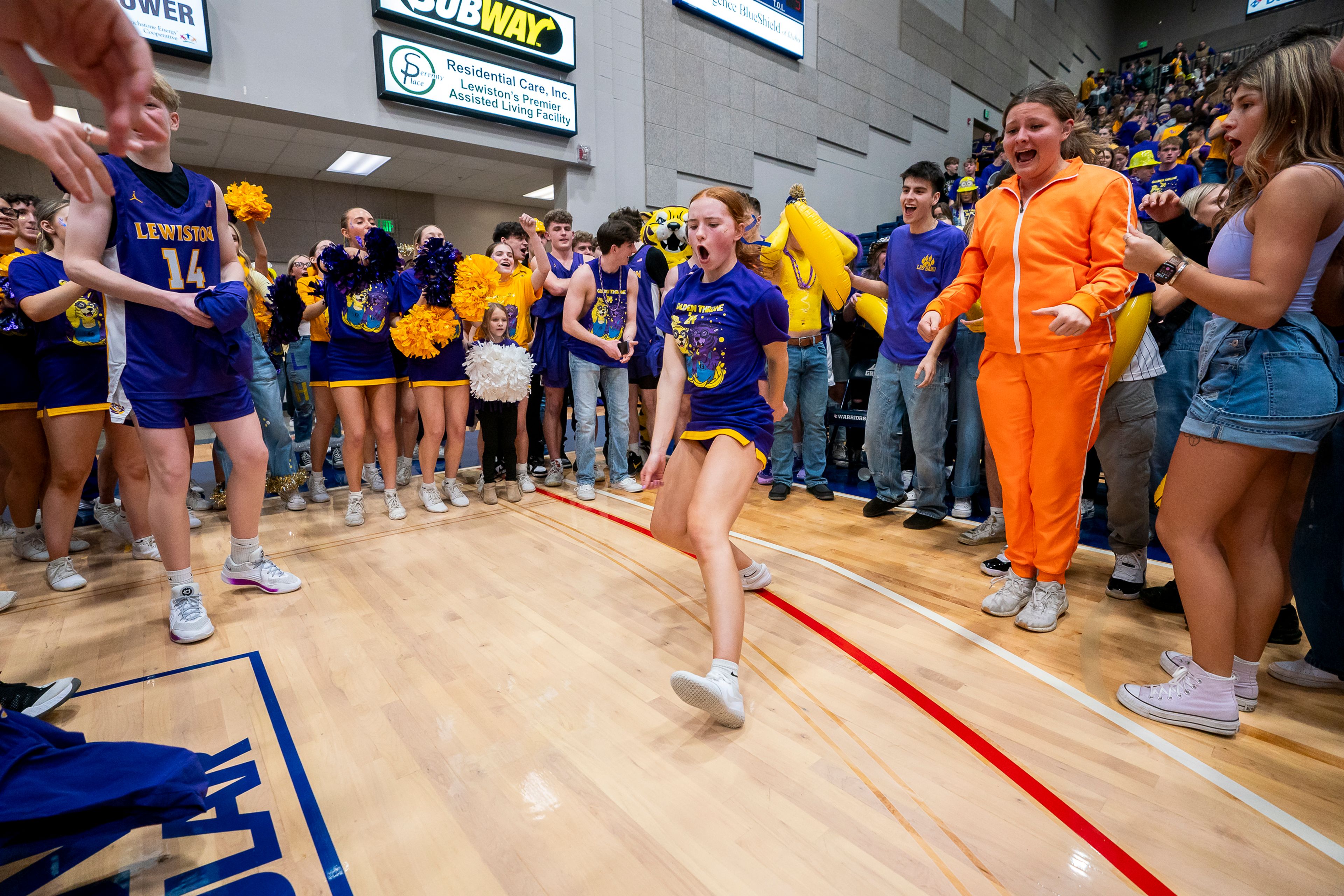 The Lewiston High School student section celebrates after winning the Golden Throne on Friday inside the P1FCU Activity Center in Lewiston.