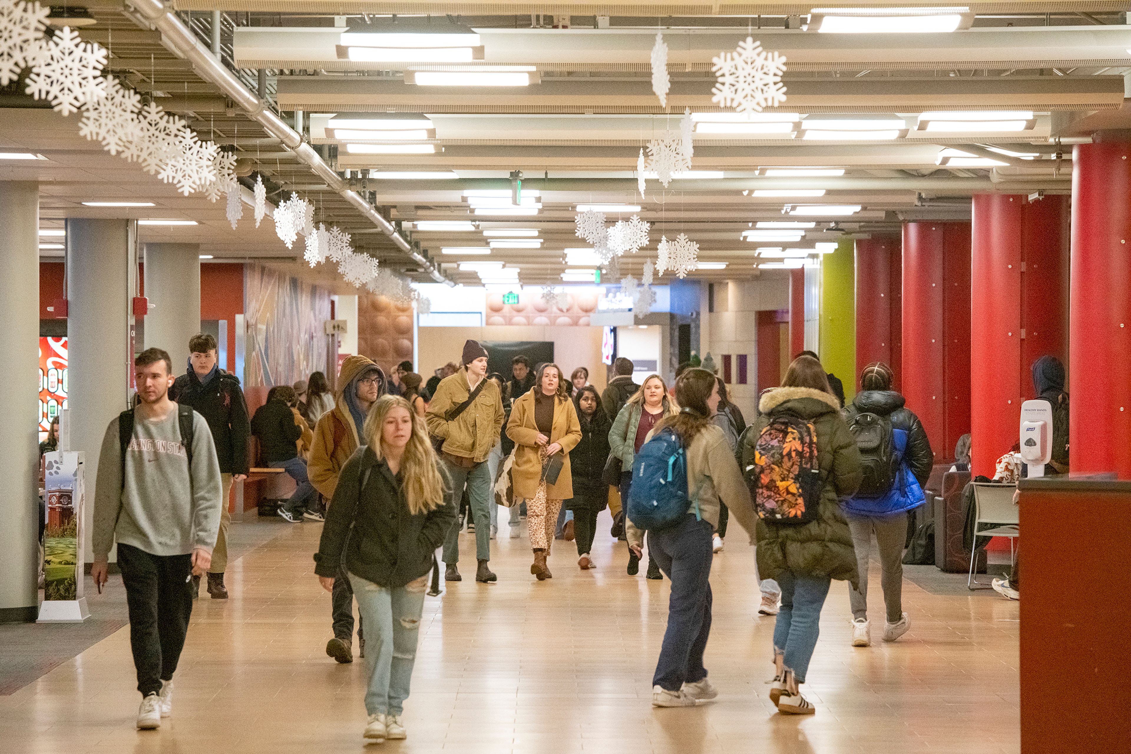 Washington State University students walk through the Compton Union Building on the first day of spring semester in Pullman on Monday.