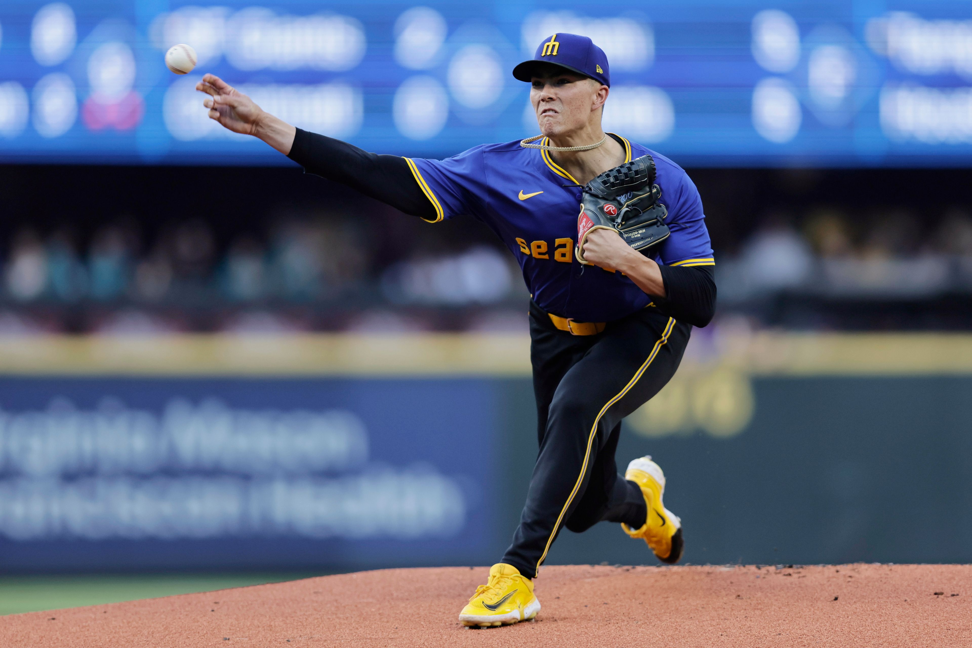 Seattle Mariners starting pitcher Bryan Woo throws against the Philadelphia Phillies during the first inning in a baseball game, Friday, Aug. 2, 2024, in Seattle. (AP Photo/John Froschauer)