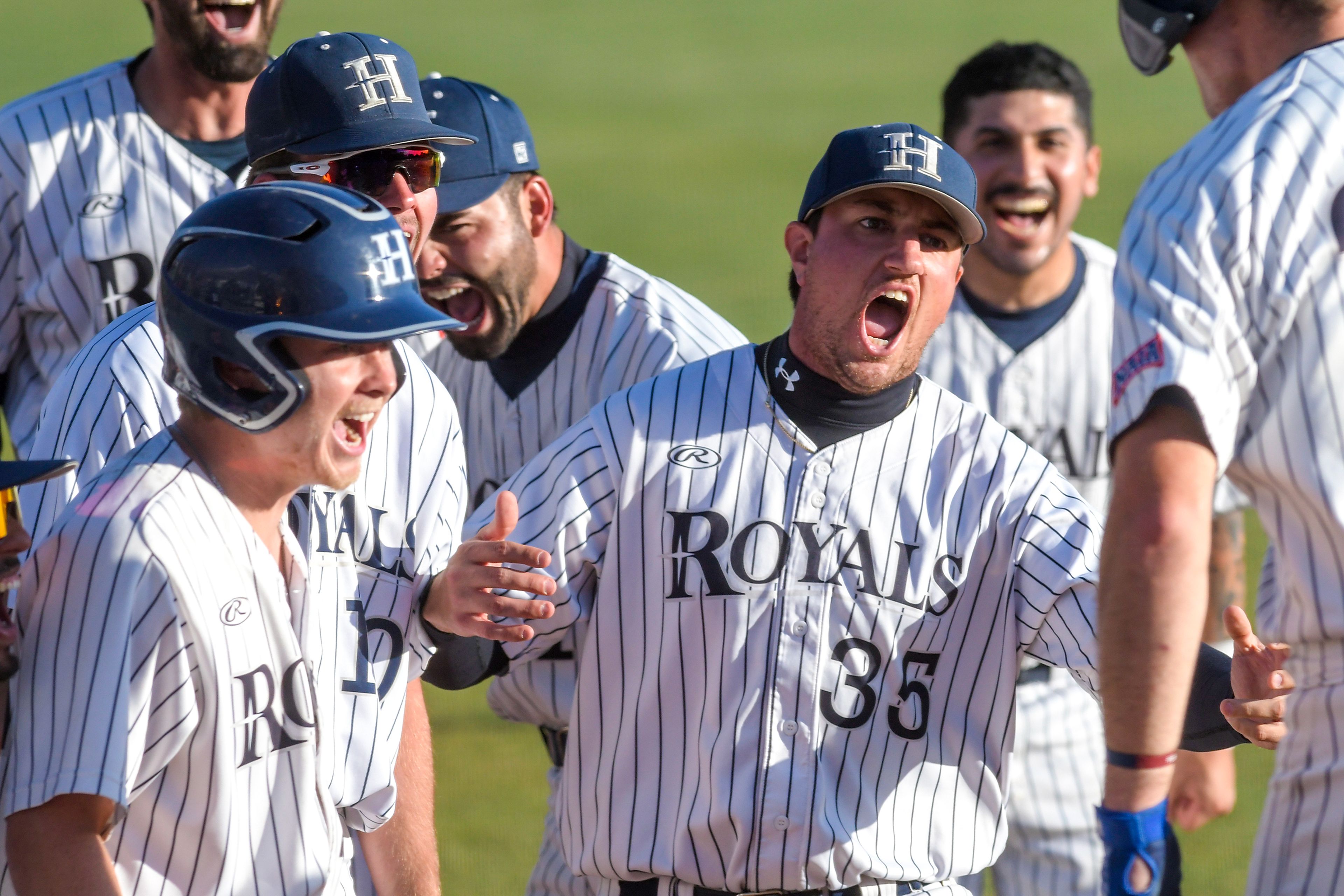 Hope International celebrates a home run against Tennessee Wesleyan in Game 19 of the NAIA World Series on Friday at Harris Field in Lewiston.