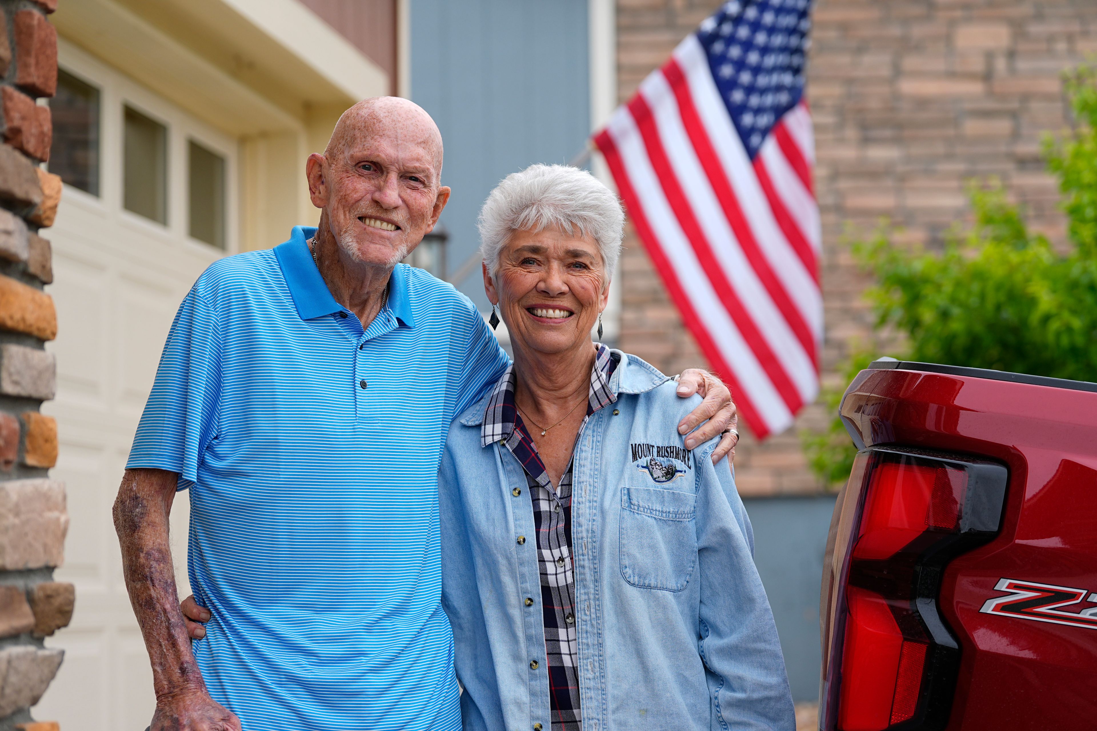 Tom McAdam and his wife, Beverly, stand outside their home Friday, May 31, 2024, in Broomfield, Colo. The retired couple's home in the northwest Denver suburb has risen 45 percent in value since purchasing six years ago that has increased their property tax. The couple is backing a Colorado ballot proposal that could cap the growth of property tax revenue, one of several measures in states this year to limit, cut or offset escalating property taxes in response to the complaints of residents.