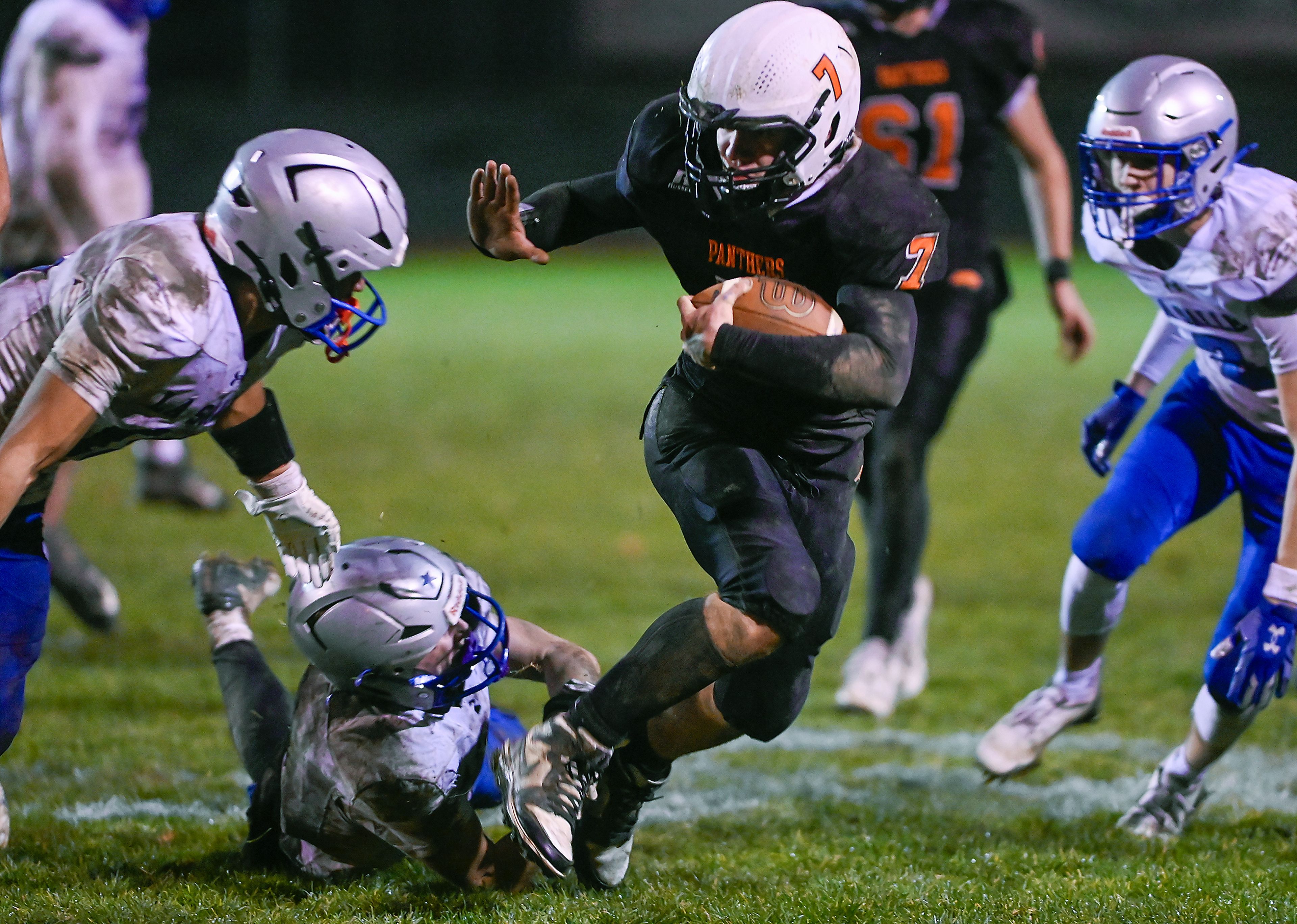 Asotin’s Cody Ells carries the ball downfield before being pushed out of bounds by La Salle defenders Saturday  during a Washington 2B state tournament game in Clarkston.