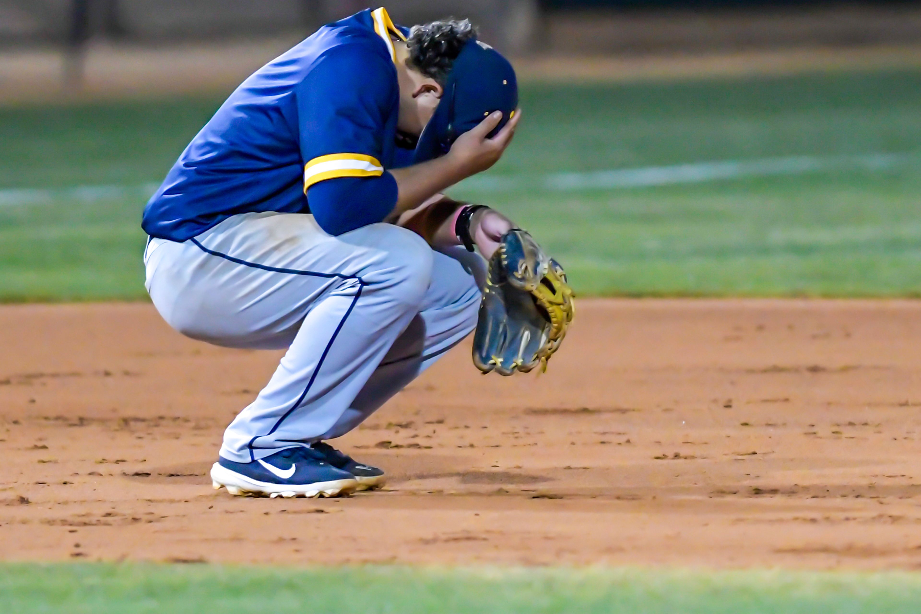 Reinhardt’s Luis Mendoza bows his head after losing to Tennessee Wesleyan in Game 18 of the NAIA World Series at Harris Field Thursday in Lewiston.