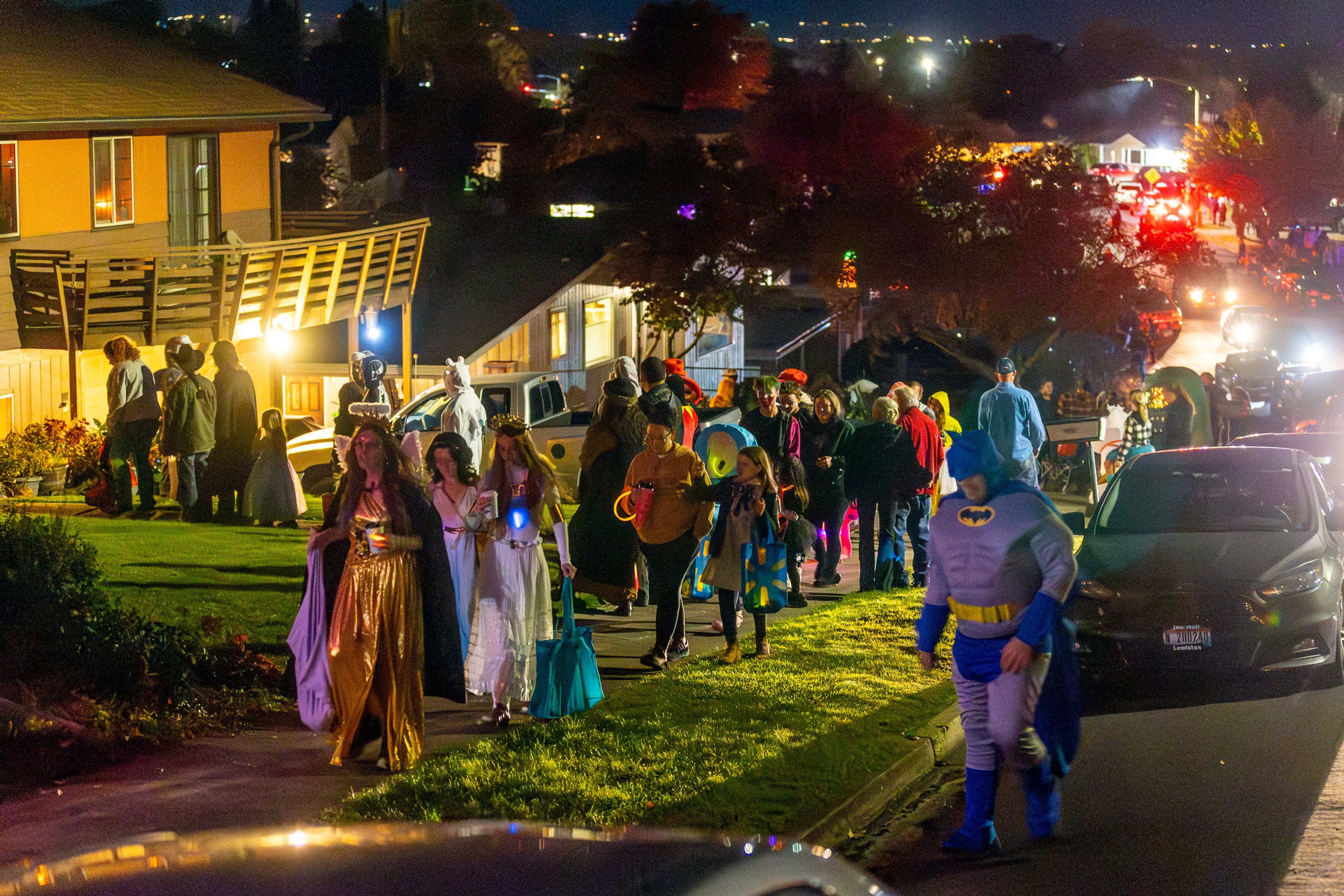 The sidewalks fill Thursday with trick-or-treaters ranging from queens to Batman in the Sunset Drive neighborhood in Lewiston.