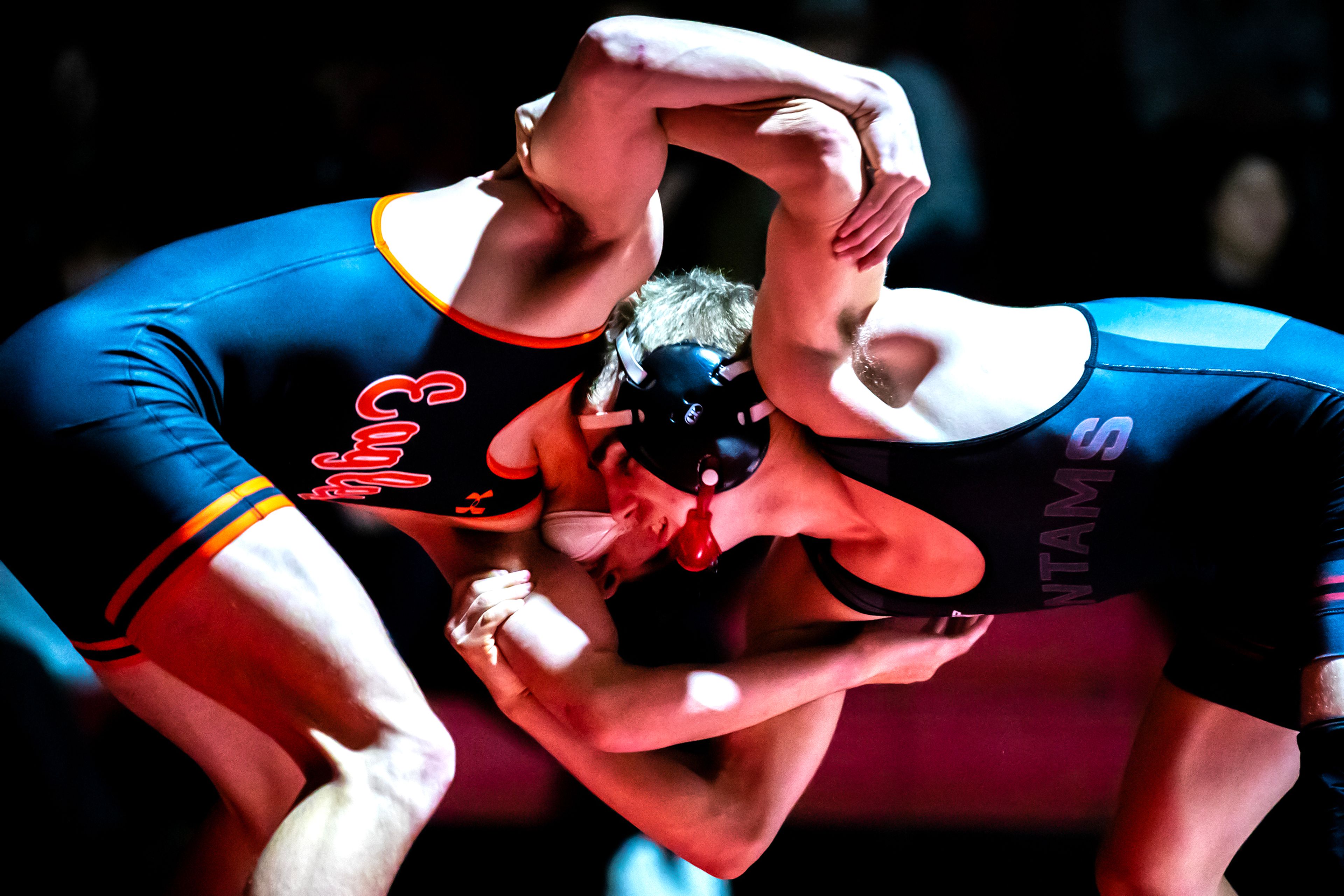 Clarkston’s Dawson Bailey grapples with West Valley’s Logan Utecht in the 144 pound weight class match during a wrestling duel Wednesday at Clarkston.