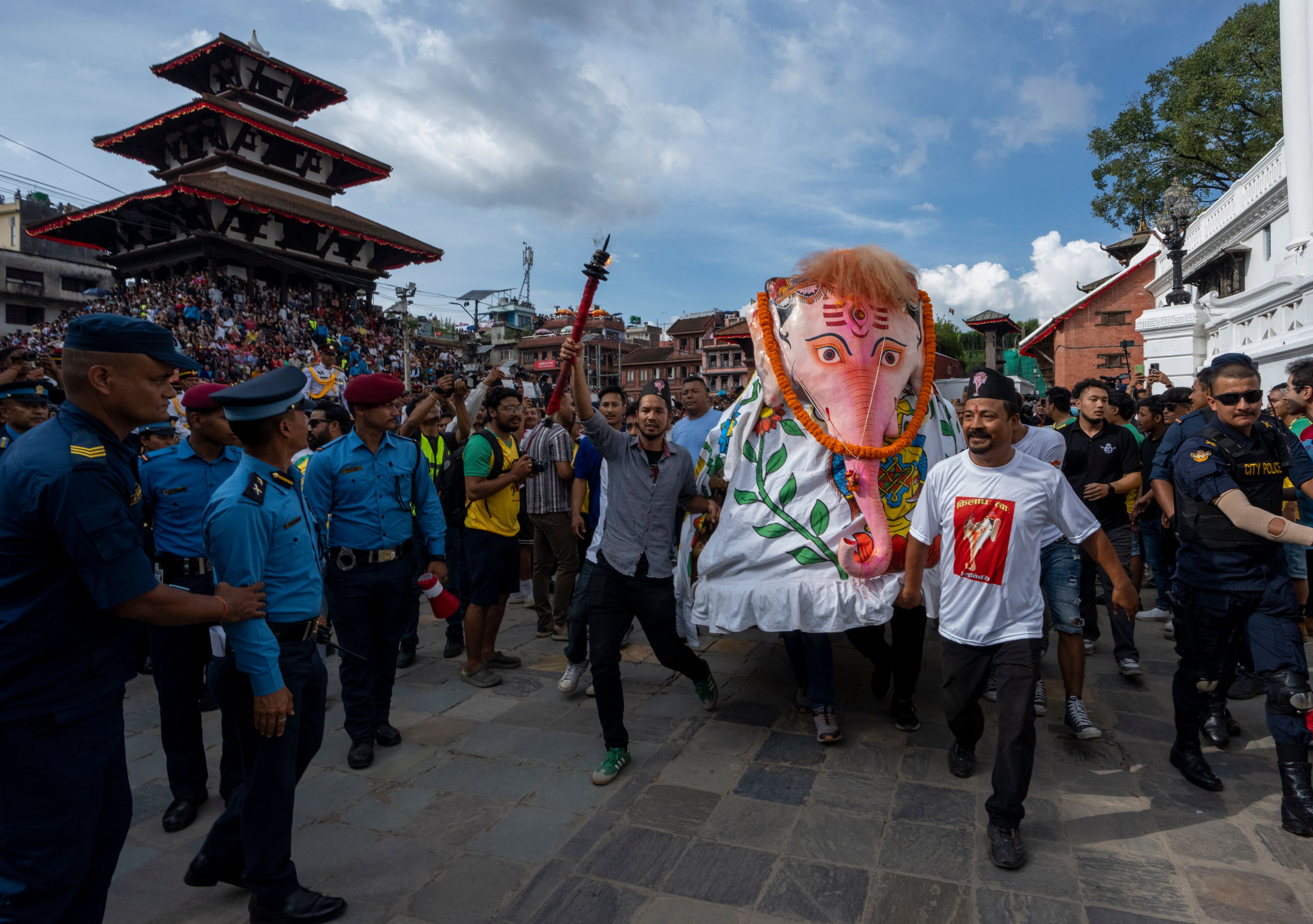 Devotees perform a traditional elephant dance during Indra Jatra, a festival that marks the end of the rainy season in Kathmandu, Nepal, Tuesday, Sept. 17, 2024. (AP Photo/Niranjan Shrestha)