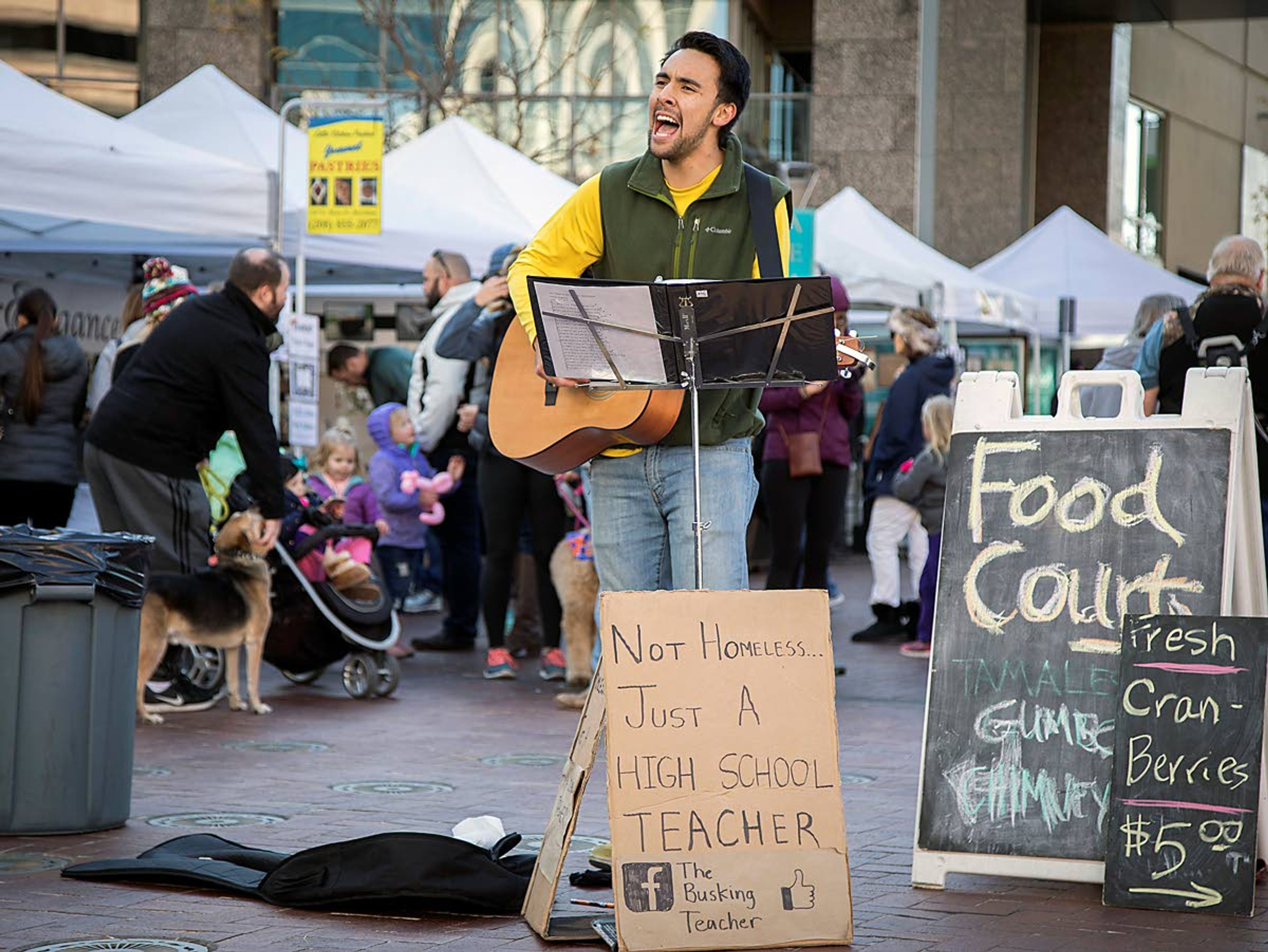 In this photo taken Nov. 26, Tanner Faris, sings and plays his guitar in Boise. Faris, 25, is a math teacher in Centennial High School’s English as a New Language department. He helps refugee kids, ages 14 to 20 years old, learn math — and English — through immersion in reading, writing, speaking and listening.