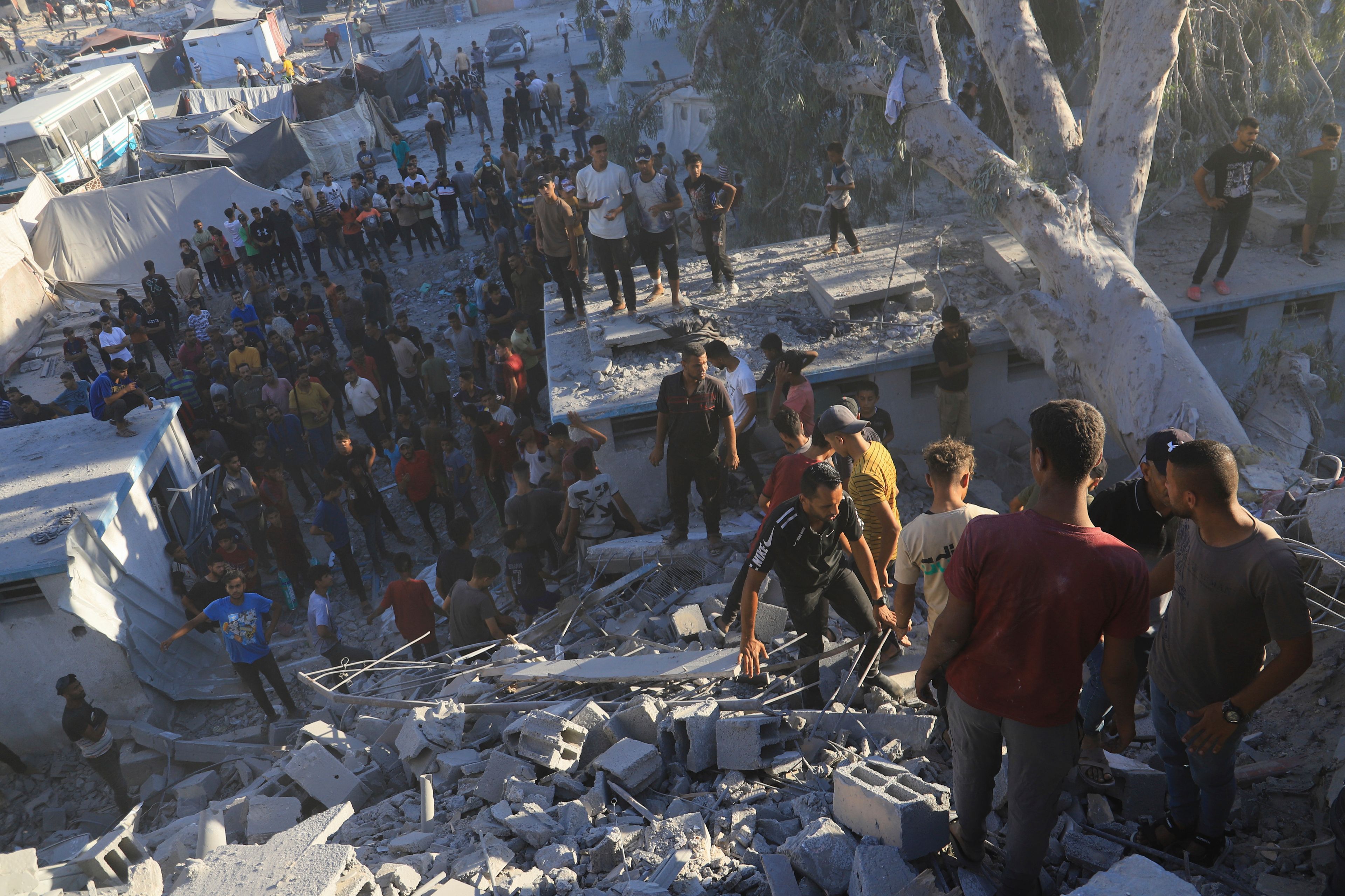 Palestinians search for bodies and survivors in the rubble of a residential building destroyed in an Israeli airstrike in Khan Younis, Gaza Strip, Wednesday, July 3, 2024. (AP Photo /Jehad Alshrafi)