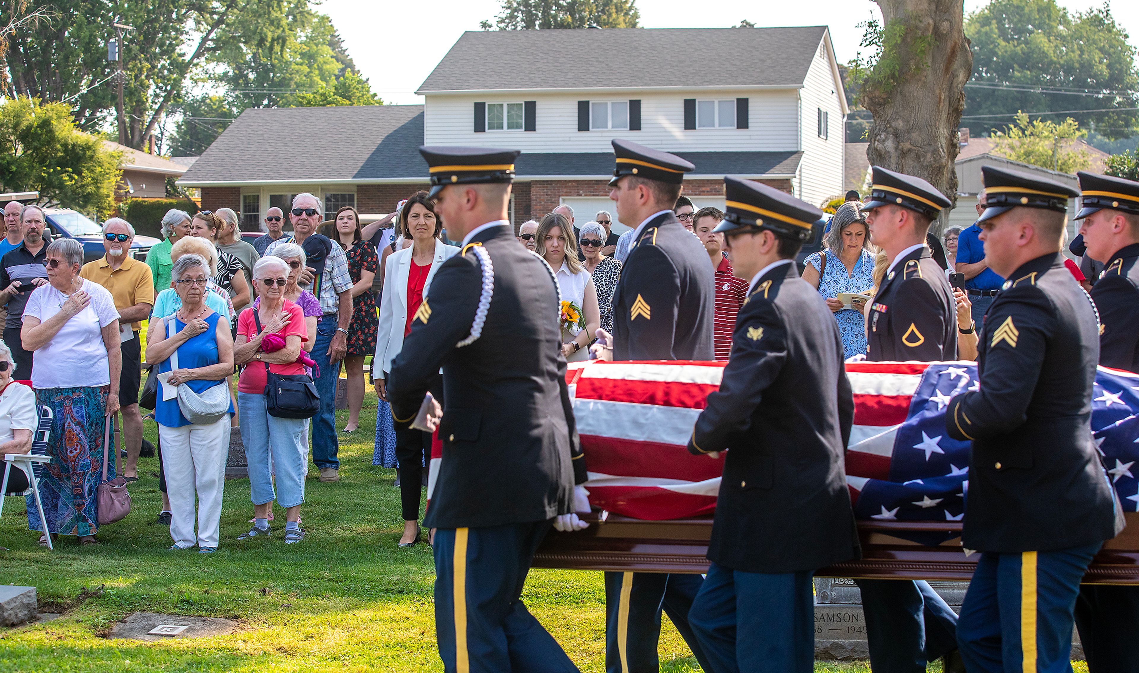 Allan Knepper’s casket is carried towards his final resting place at his funeral Thursday at the Normal Hill Cemetery in Lewiston.