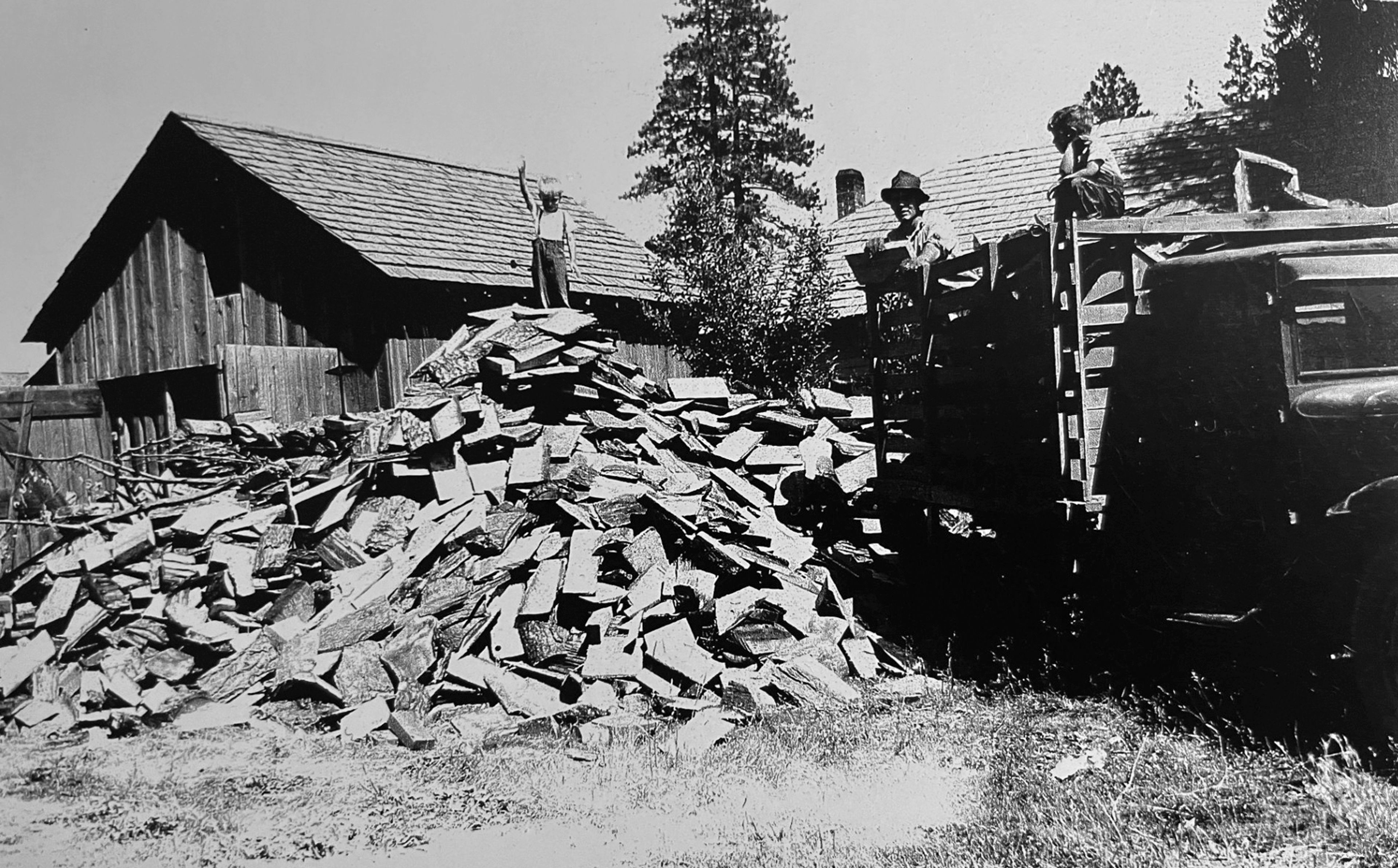 
The Bull family gets ready for winter at their Princeton home by unloading a truck load of slab wood in this photo taken in 1951. Bill Bull stands atop the pile of wood with hand raised and his brother Andy Bull perches on the wood still waiting to be unloaded from the back of the truck. Their father, Alec Bull, leans on the rail of the truck during a pause in the unloading for this photo taken by his wife (and the boys’ mom), Margaret Bull. The slab wood came from Boone’s Lumber Mill, about three miles east of Princeton, according to Andy Bull, of Creswell, Ore., who submitted this photo. He wrote, “Back then, the mills would give the wood away rather than just burn it themselves as it was an unwanted byproduct of producing lumber.” The Bulls needed the wood for the wood-burning stoves in their home and in the post office building, which they also owned. Alec was the postmaster in Princeton. Readers who would like to share their historical photos (20 years or older) from throughout the region may do so by emailing them to blasts@lmtribune.com or submitting them to: Blast from the Past, P.O. Box 957, Lewiston, ID 83501. Questions? Call Jeanne M. DePaul at (208) 848-2221.