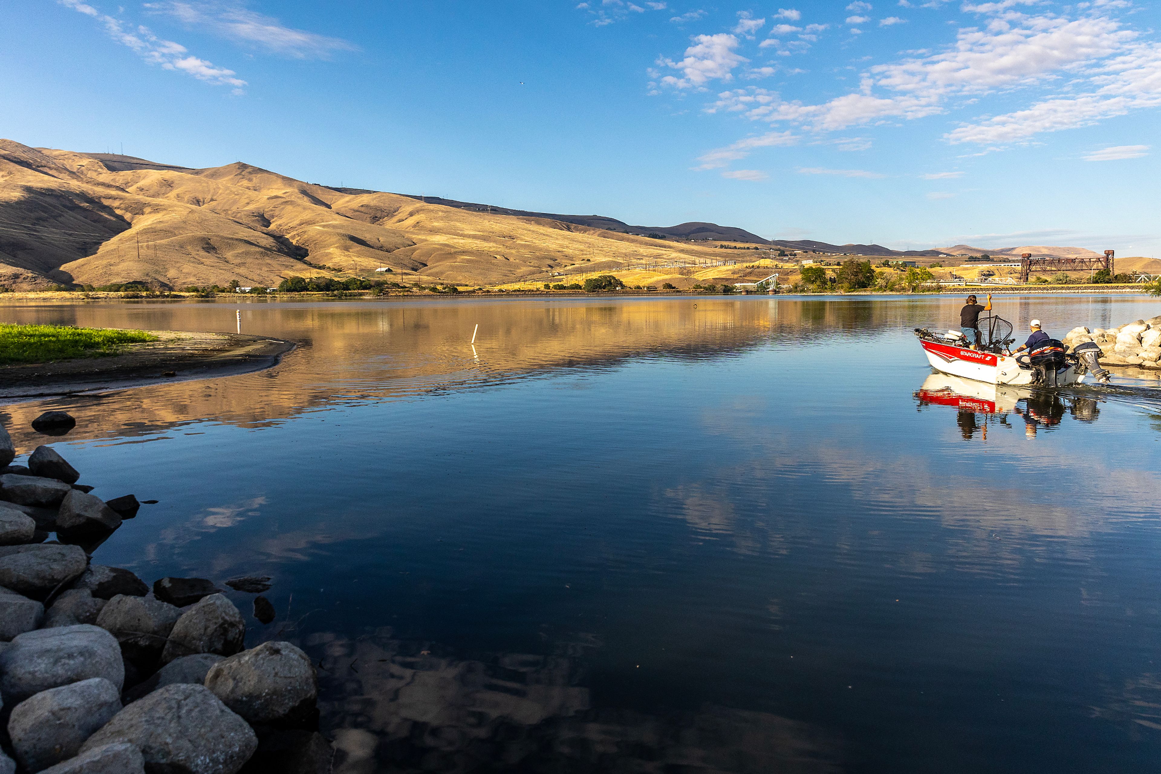 Boaters make their way out of the Greenbelt Boat Launch area on the lower Snake River on Wednesday evening in Clarkston. Accumulation of sand at the mouth of the launch has made it difficult for some boats to use the area.